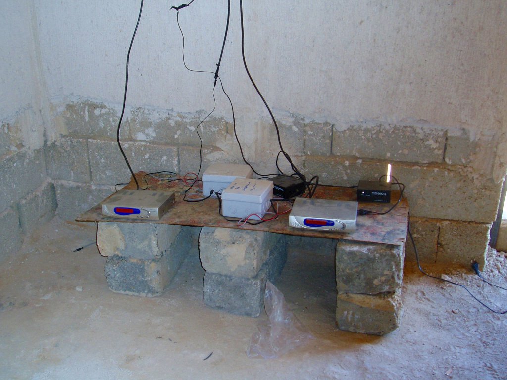 Improvised explosive devices found in a house under construction in Iraq, utilising video cassette recorders as timers