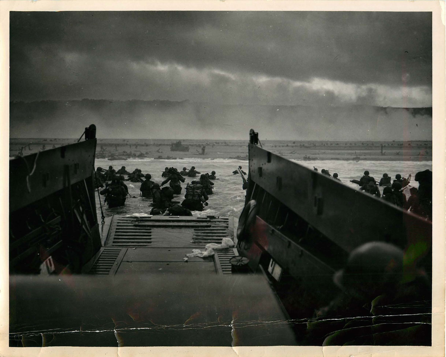 Image ID 6414569 US troops storm Omaha beach on 6 June 1944. The iconic photograph, 'Into the Jaws of Death', was shot by Chief Petty Officer Robert Sargent CREDIT US Department of Defense