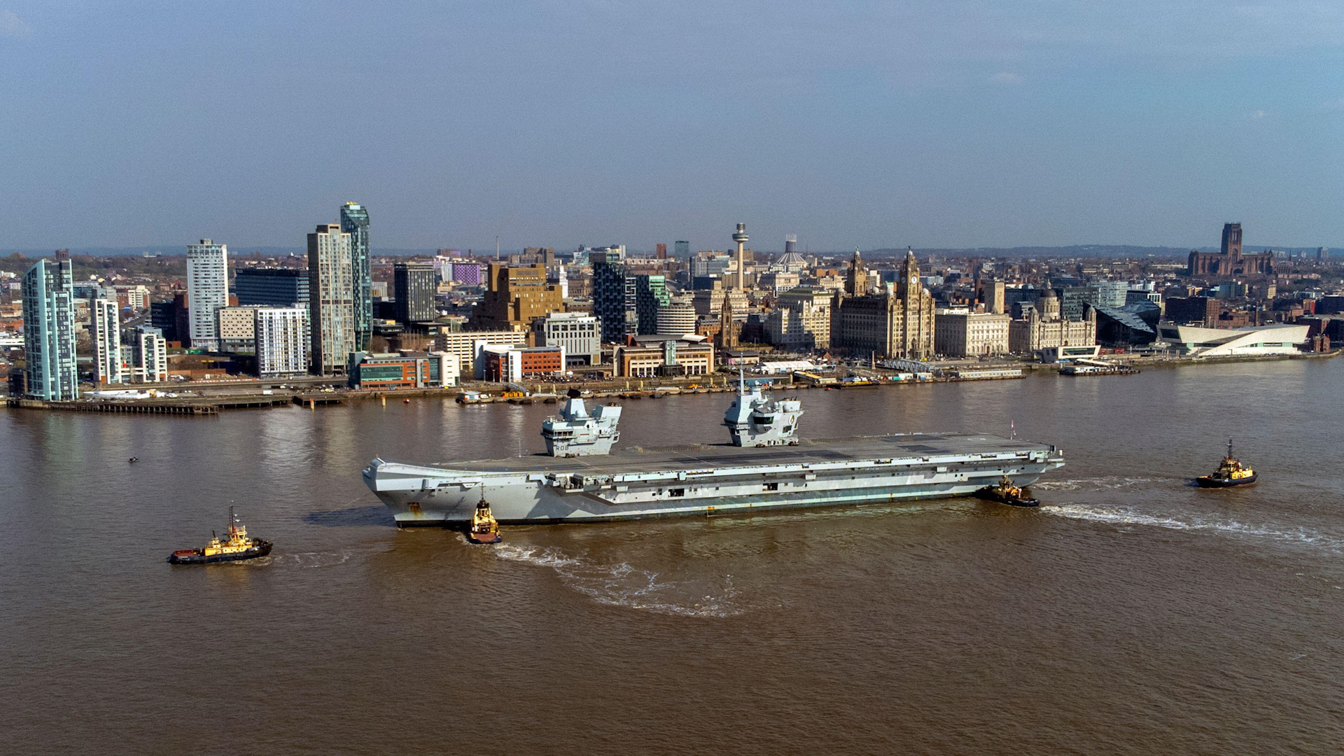 HMS Queen Elizabeth sails up River Mersey into Liverpool