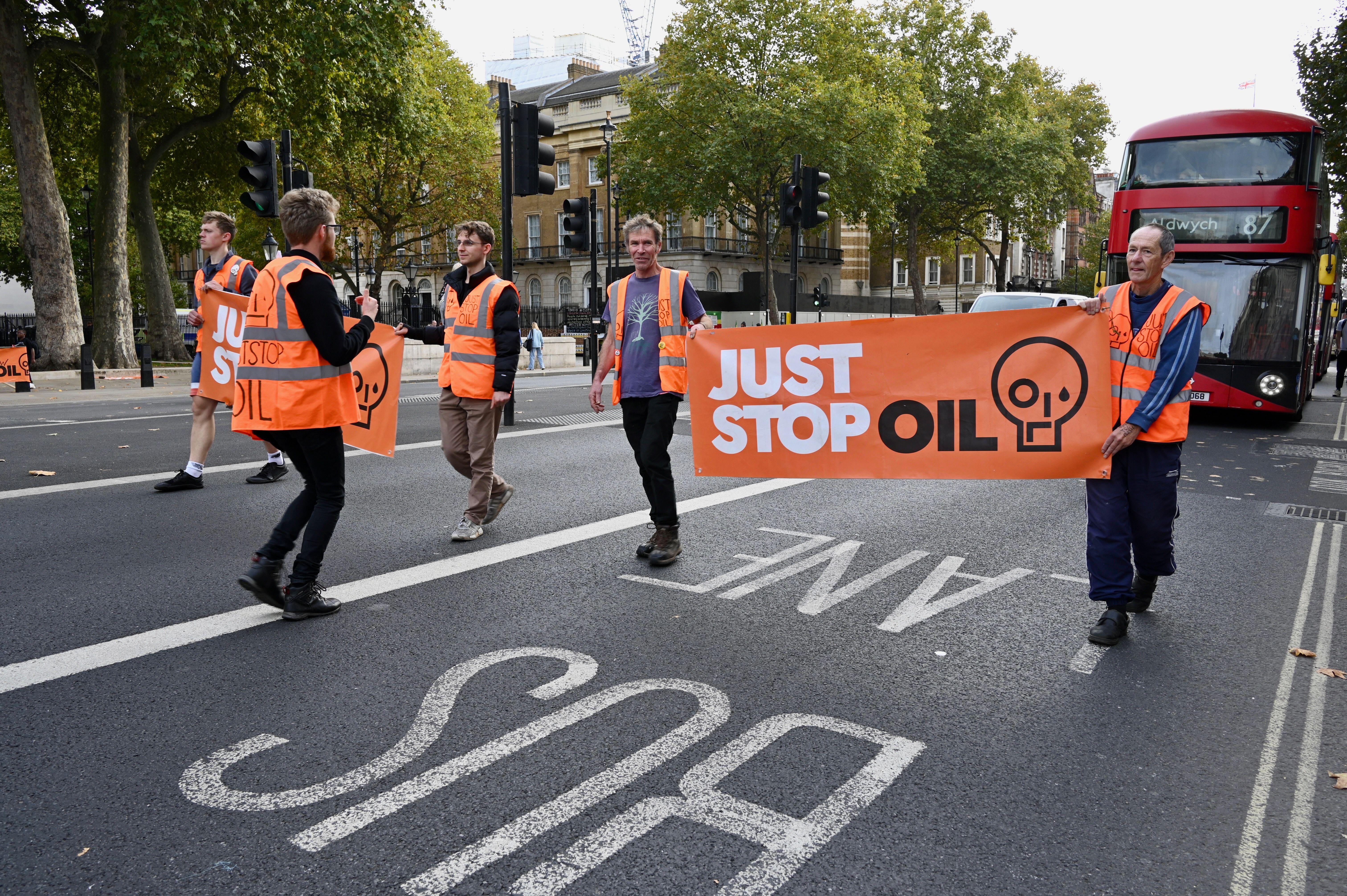  Just Stop Oil Activists block traffic in Whitehall, London. 