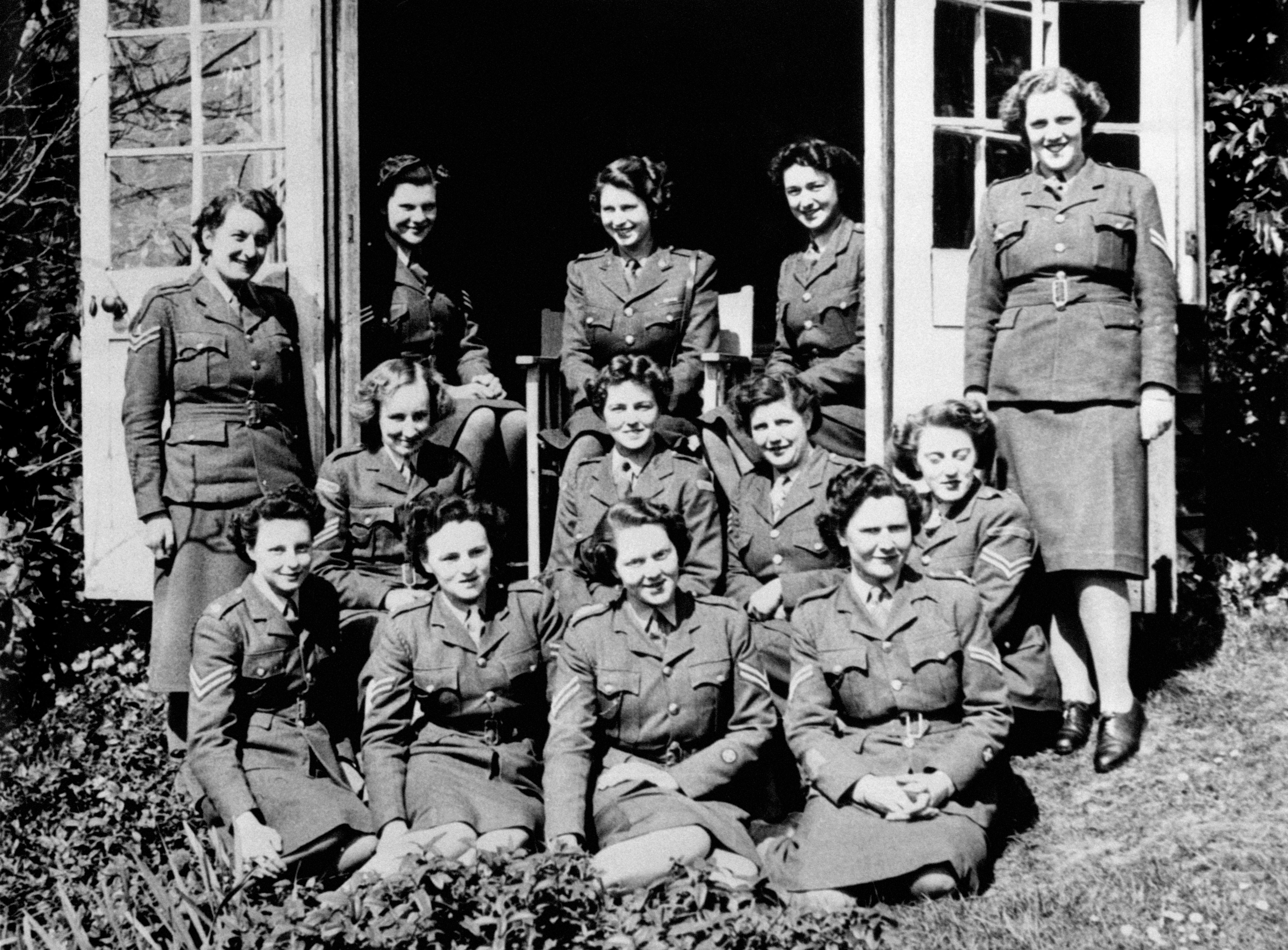 Princess Elizabeth (top, centre) in a group photograph with Senior and Junior Non Commissioned Officers on her course at No 1 MTTC at Camberley, Surrey