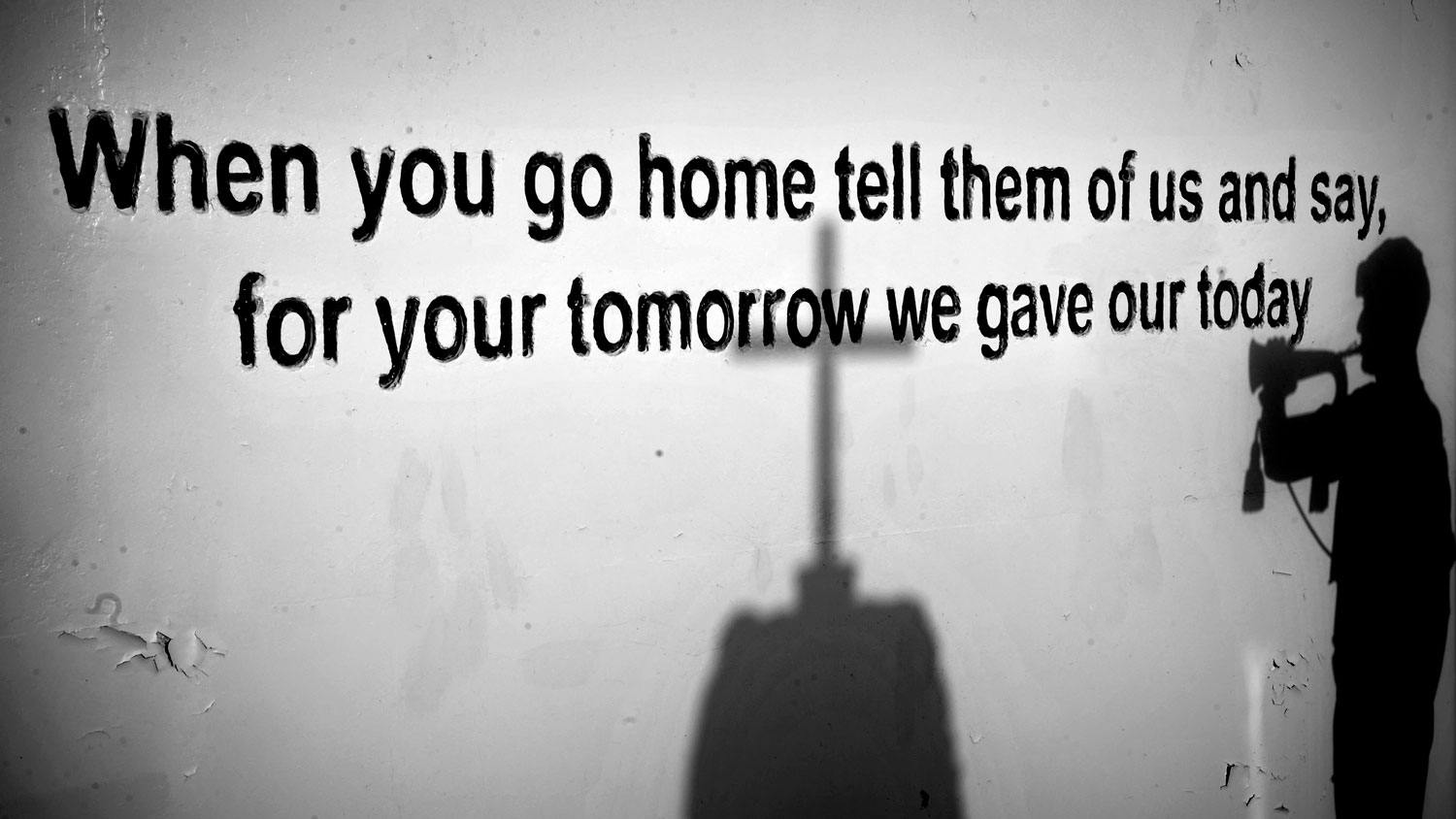 Image ID 45156080 The shadow of a Royal Marine bugler, playing the Last Post, is cast upon the memorial at camp Bastion in Afghanistan in 2011 CREDIT Crown Copyright