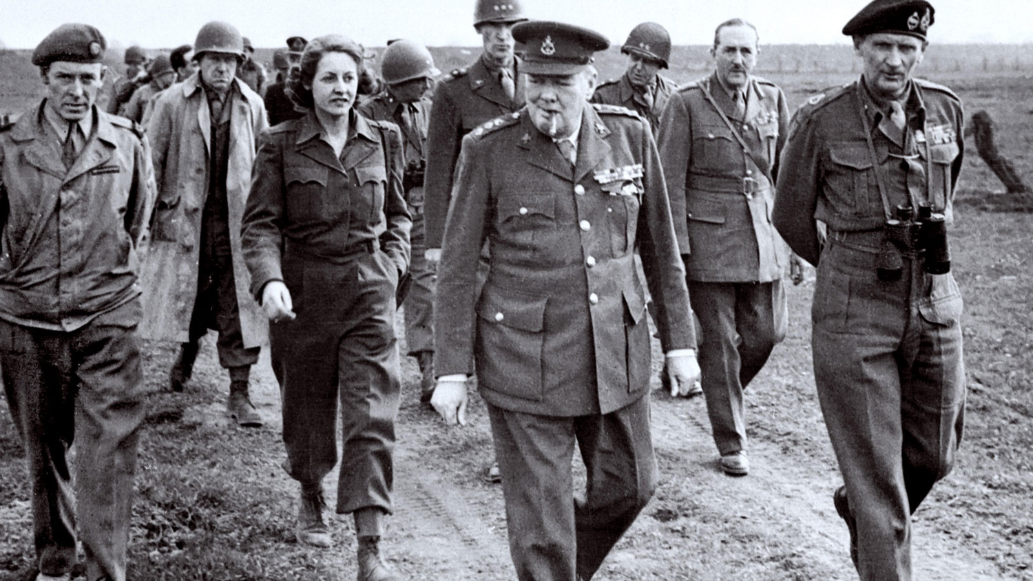 Image ID RD5KRK British Prime Minister Winston Churchill walking with Field Marshal Montgomery along the east bank of the Rhine River on 25 March 1945 CREDIT Shawshots Alamy Stock Photo EXP 231124