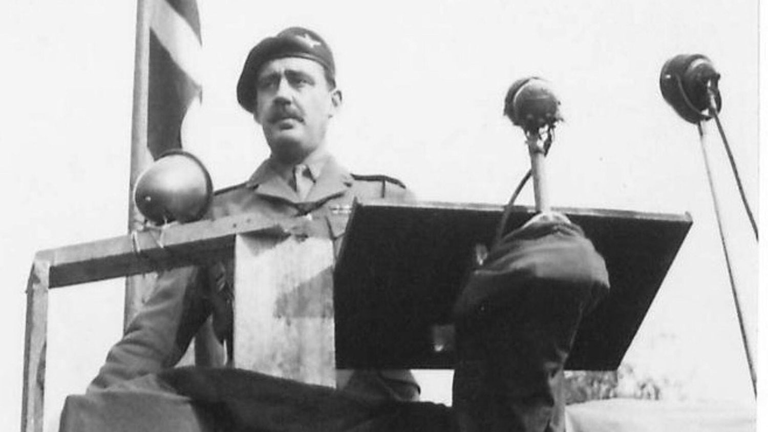 Image ID 2X0NE3T the then Lieutenant Colonel John Frost at microphone during the unveiling of the Arnhem Memorial in 1945 CREDIT piemags / ww2archive / Alamy Stock Photo EXP 231124