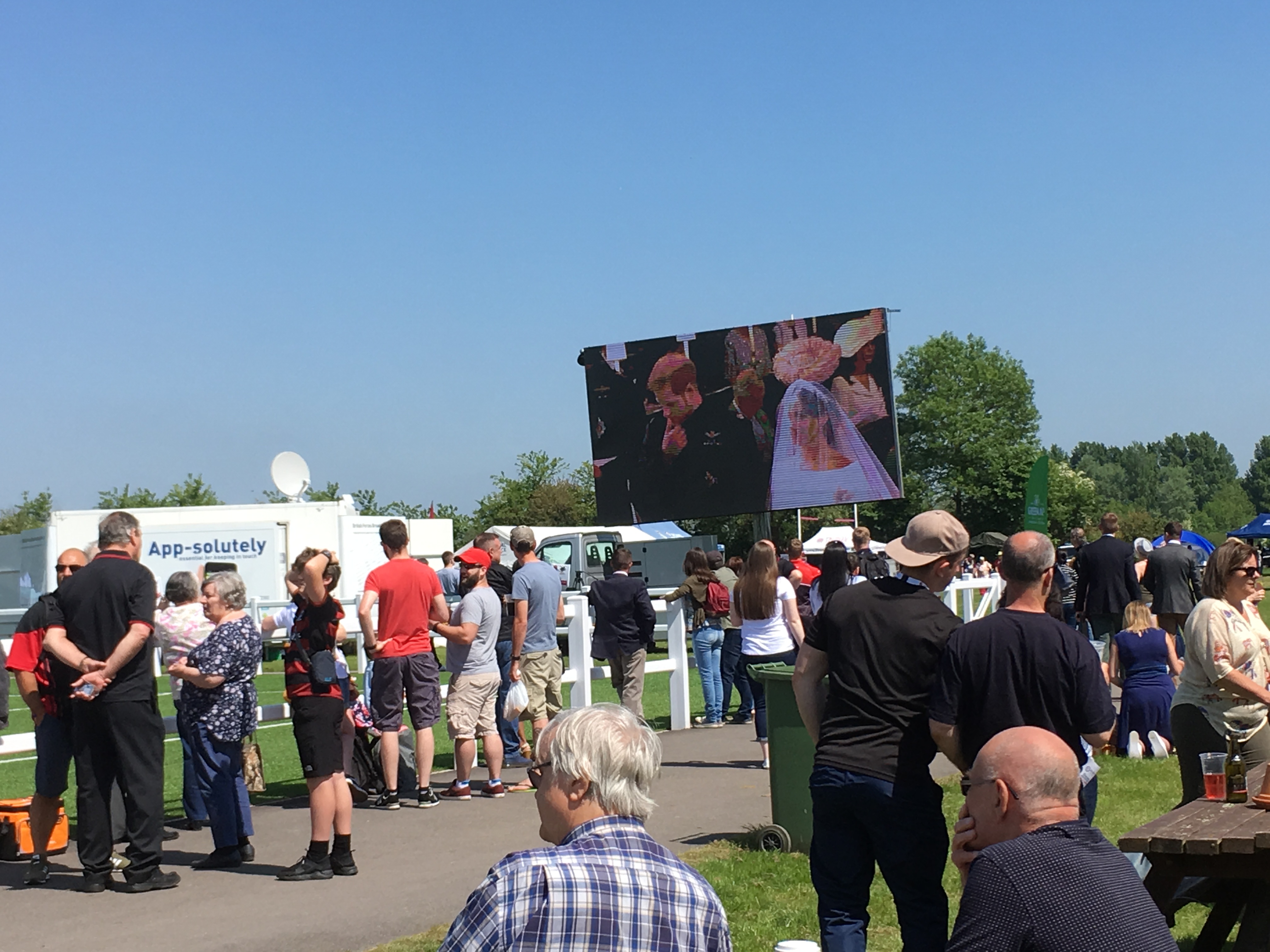 Crowds watching the Royal wedding on a CSE big screen at the centenary event of the RAF Police