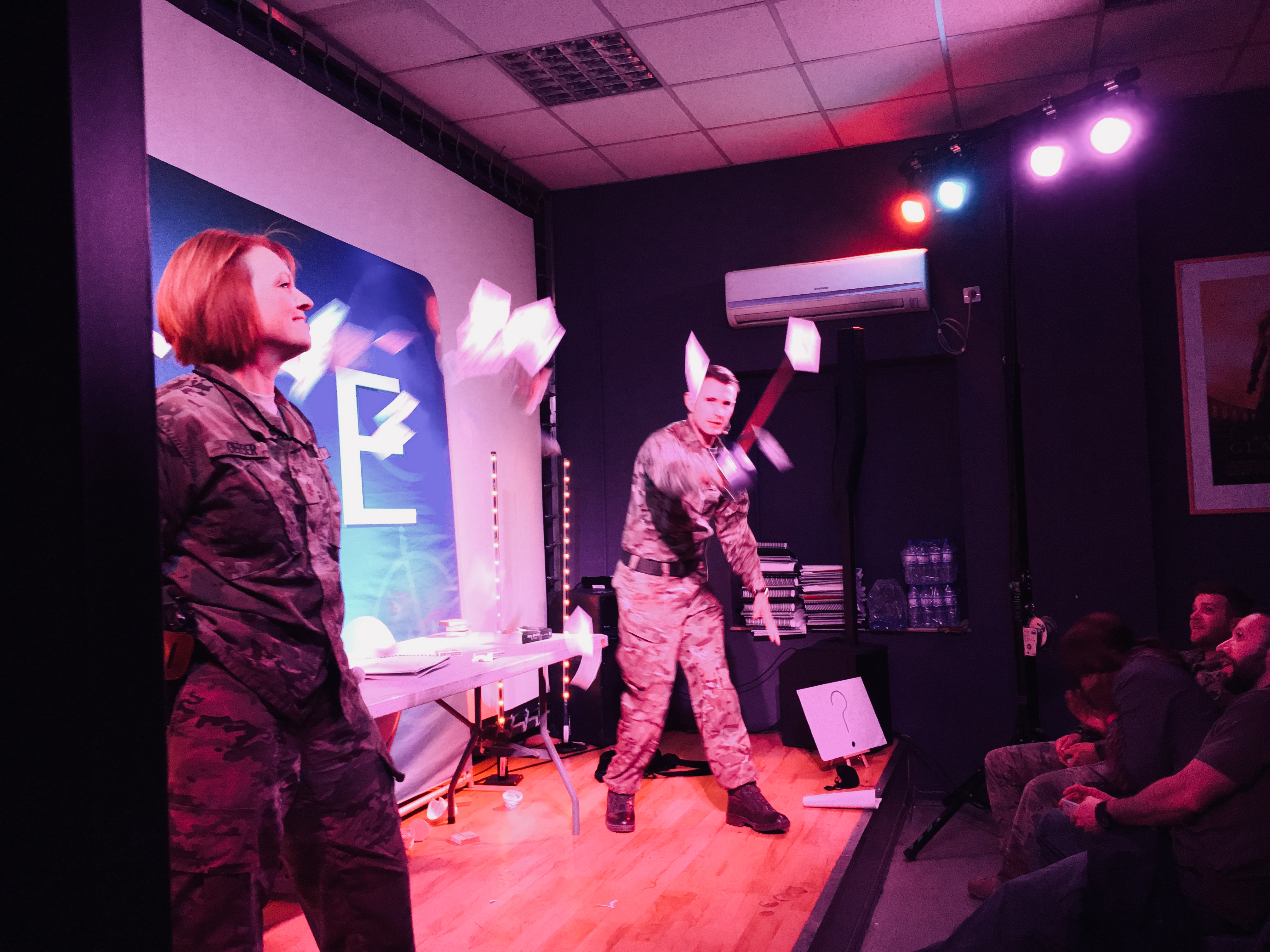 Magician Richard Jones wows the audience with his sword trick in Afghanistan