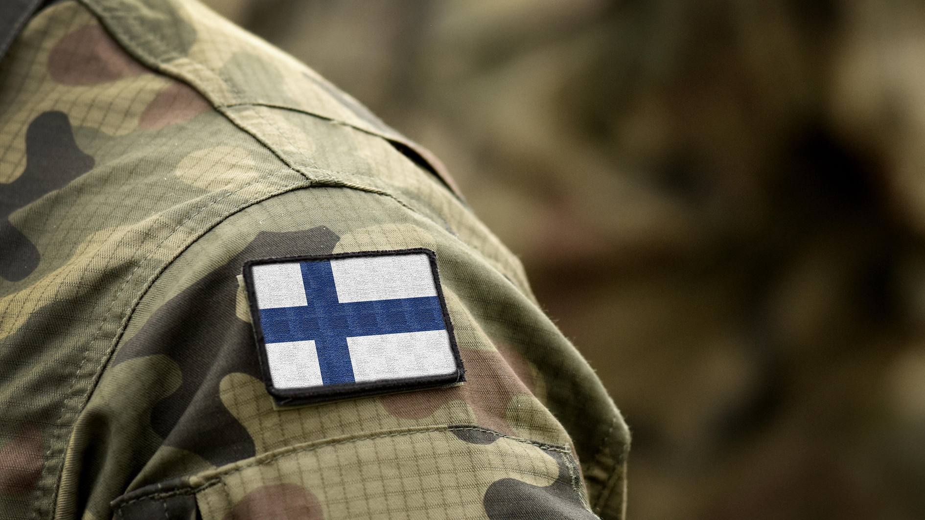 Image ID 2A7C924 Flag of Finland on military uniform. Army, troops, soldiers. Collage CREDIT ALAMY 310323