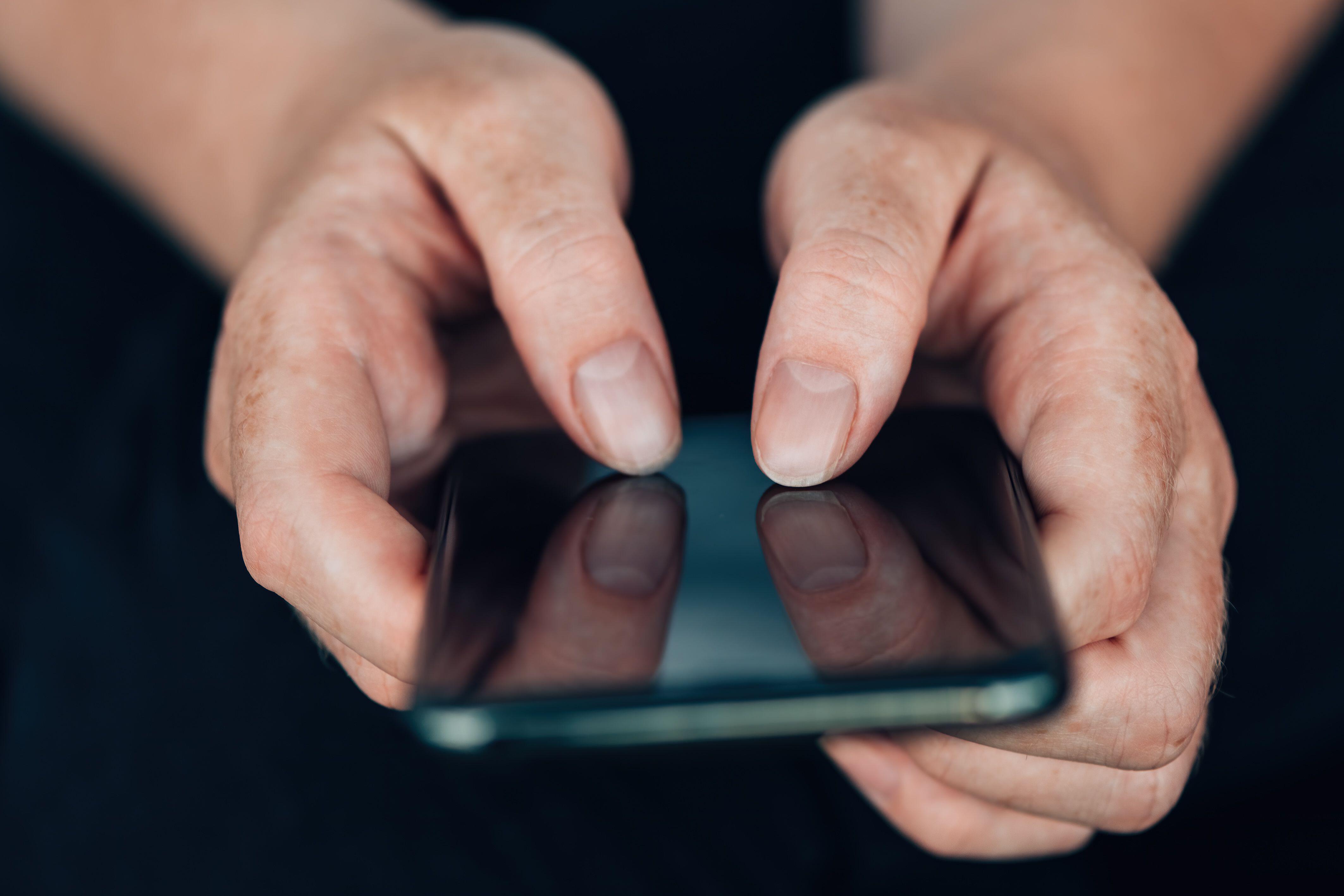 Image ID 2CC547N Anonymous hands using mobile phone 110820 CREDIT IGOR STEVANOVIC, ALAMY STOCK PHOTO