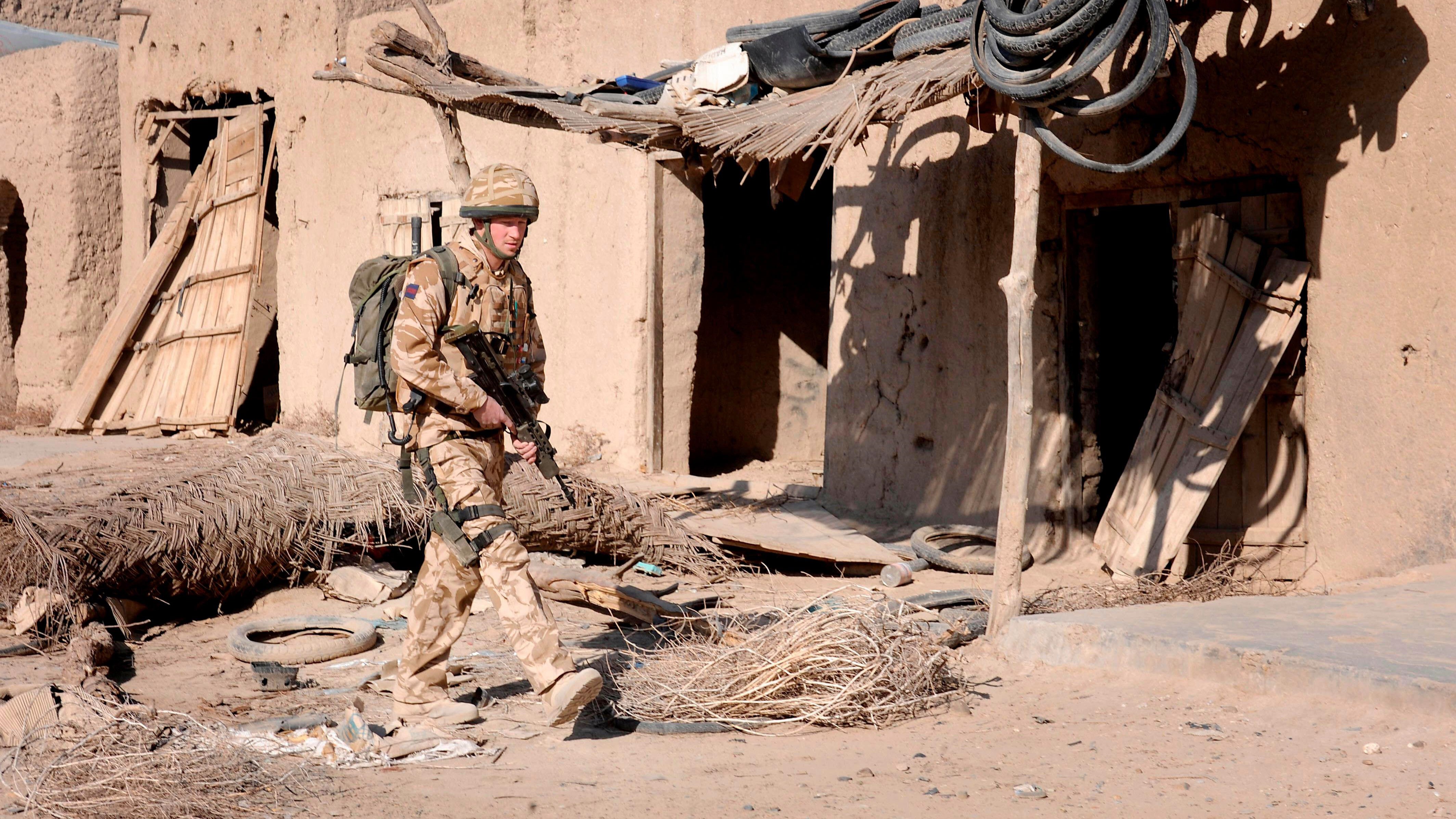 Image ID 2D17HN6 Prince Harry patrols through the deserted town of Garmisir in Helmand province Southern Afghanistan 02032008 CREDIT Reuters Alamy EXP 05012024.jpg