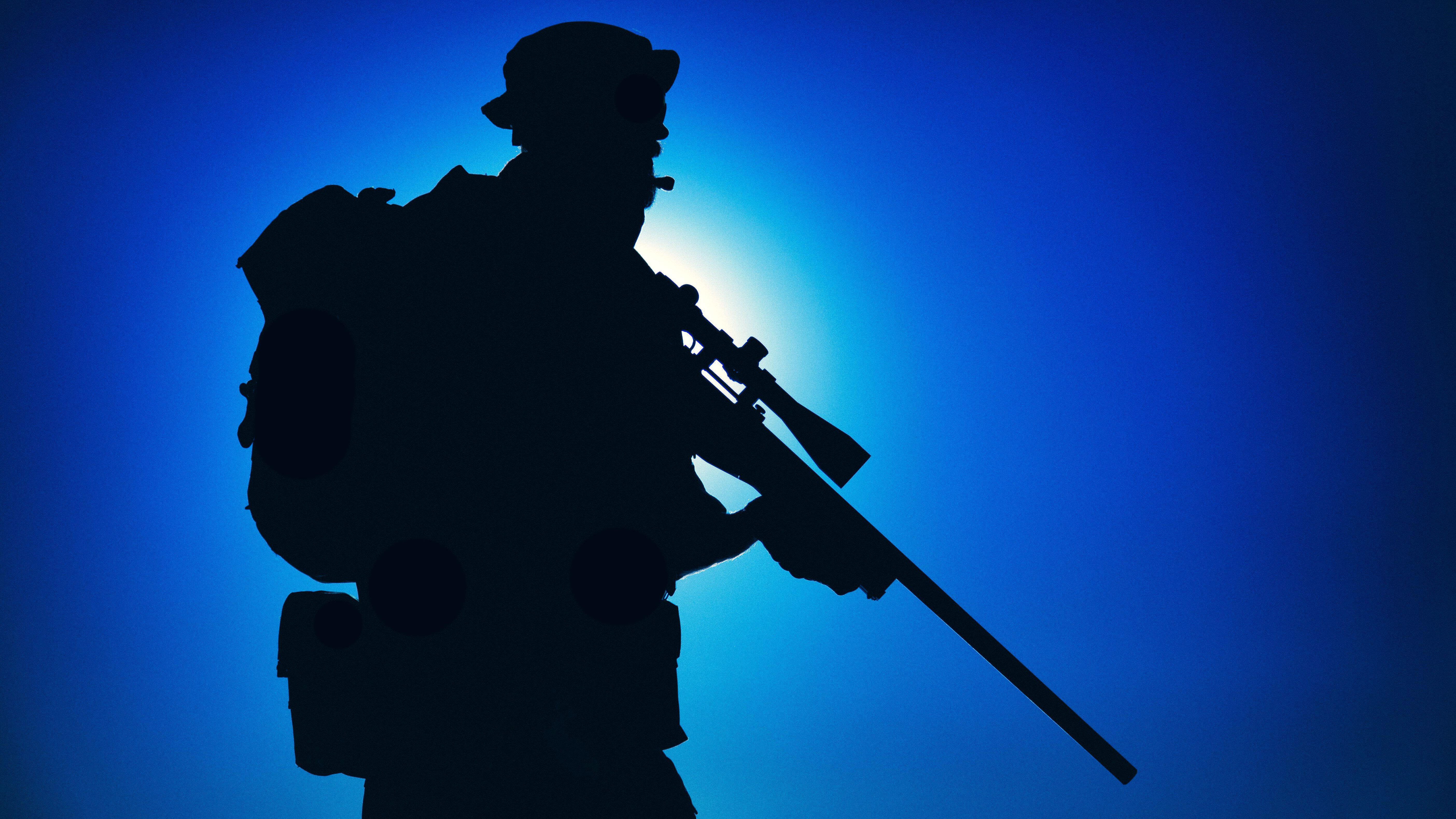 Image ID 2F5E2HT ANON Silhouette of army elite forces sniper fighter in boonie hat, carrying backpack DATE UNKNOWN CREDIT Getmilitaryphotos Alamy Stock Photo.png