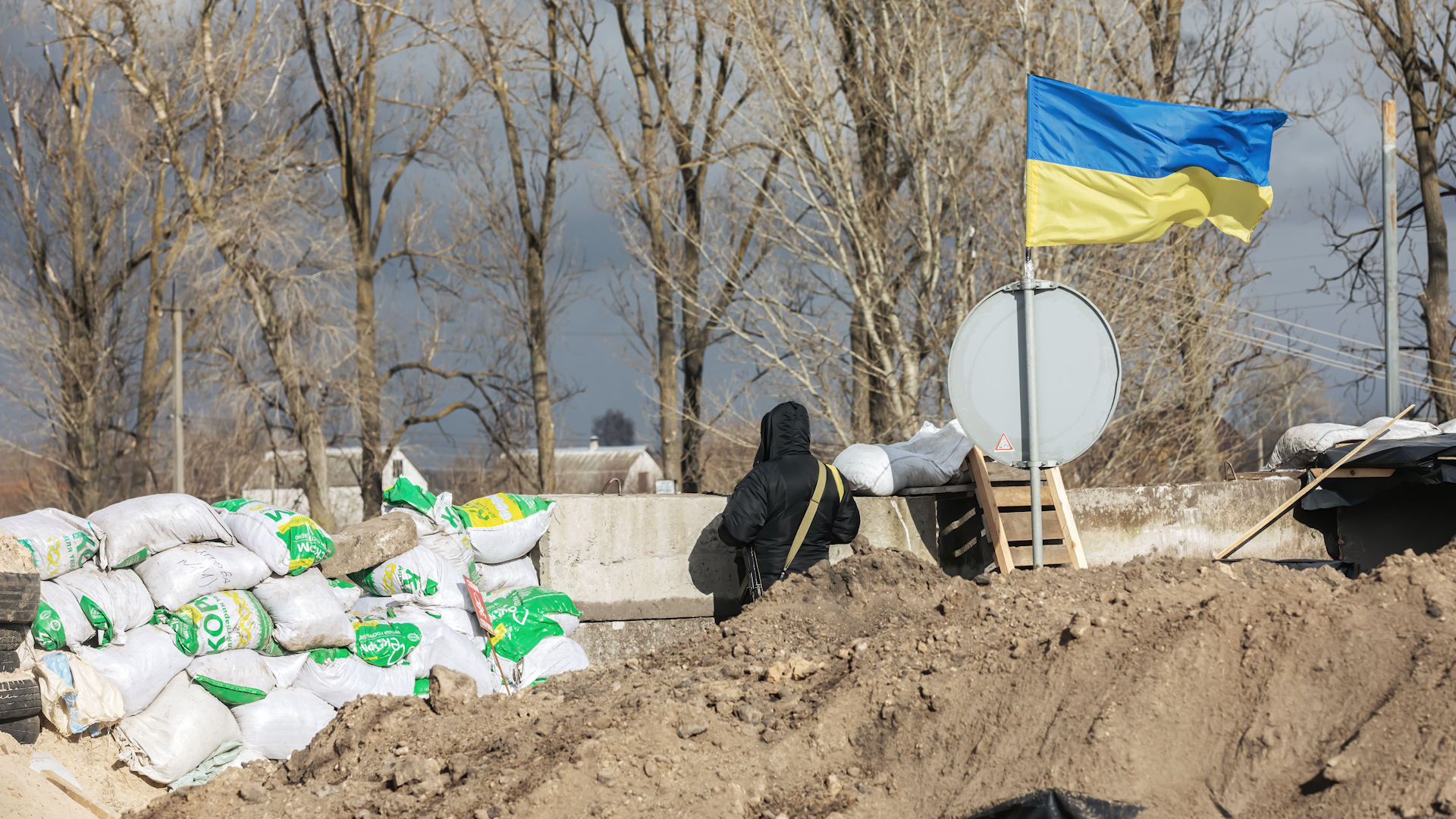 A checkpoint flying a Ukrainian flag in the Kyiv region