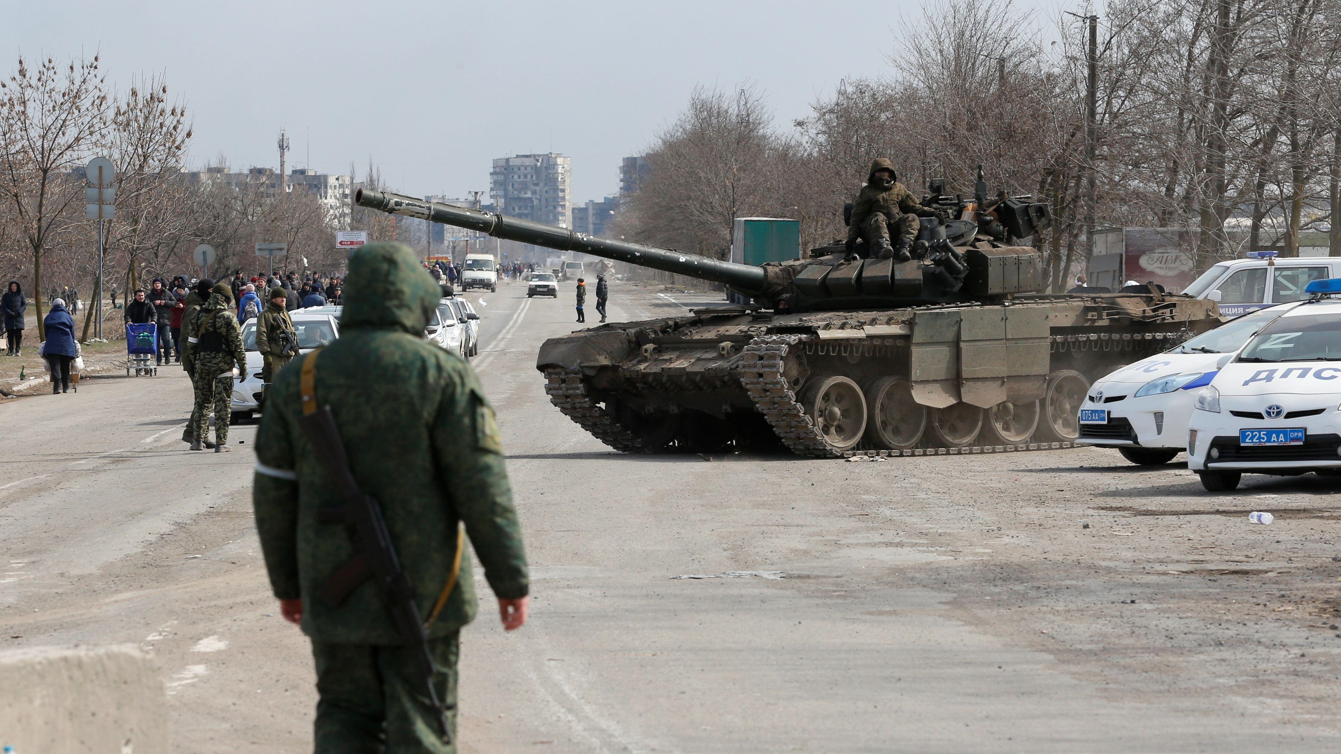 Russian troops atop tank during Ukraine-Russia conflict, outskirts of Mariupol