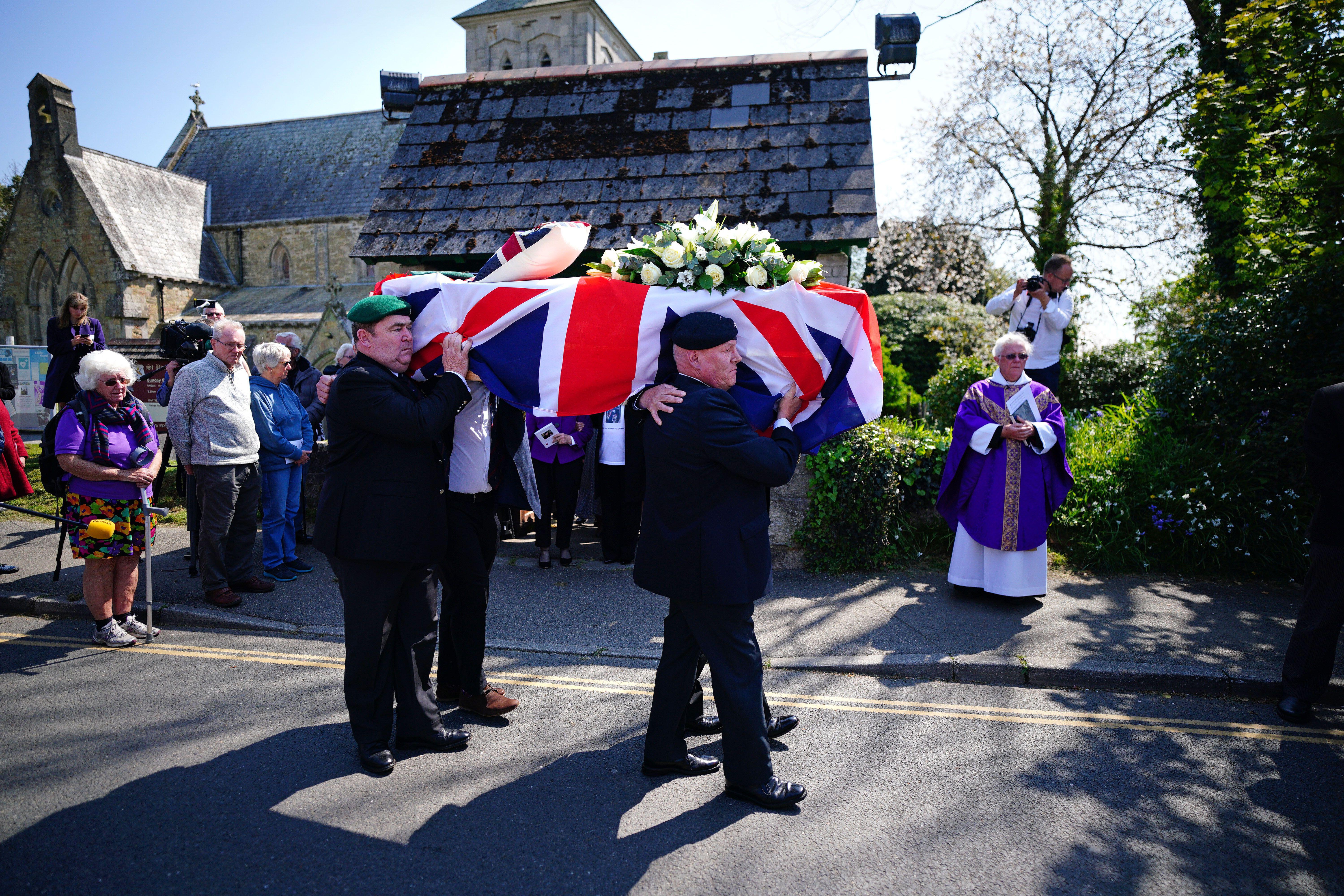 The coffin of 96-year-old World War II serviceman and Royal British Legion fundraiser Harry Billinge is carried out of St Paul's Church, Cornwall 