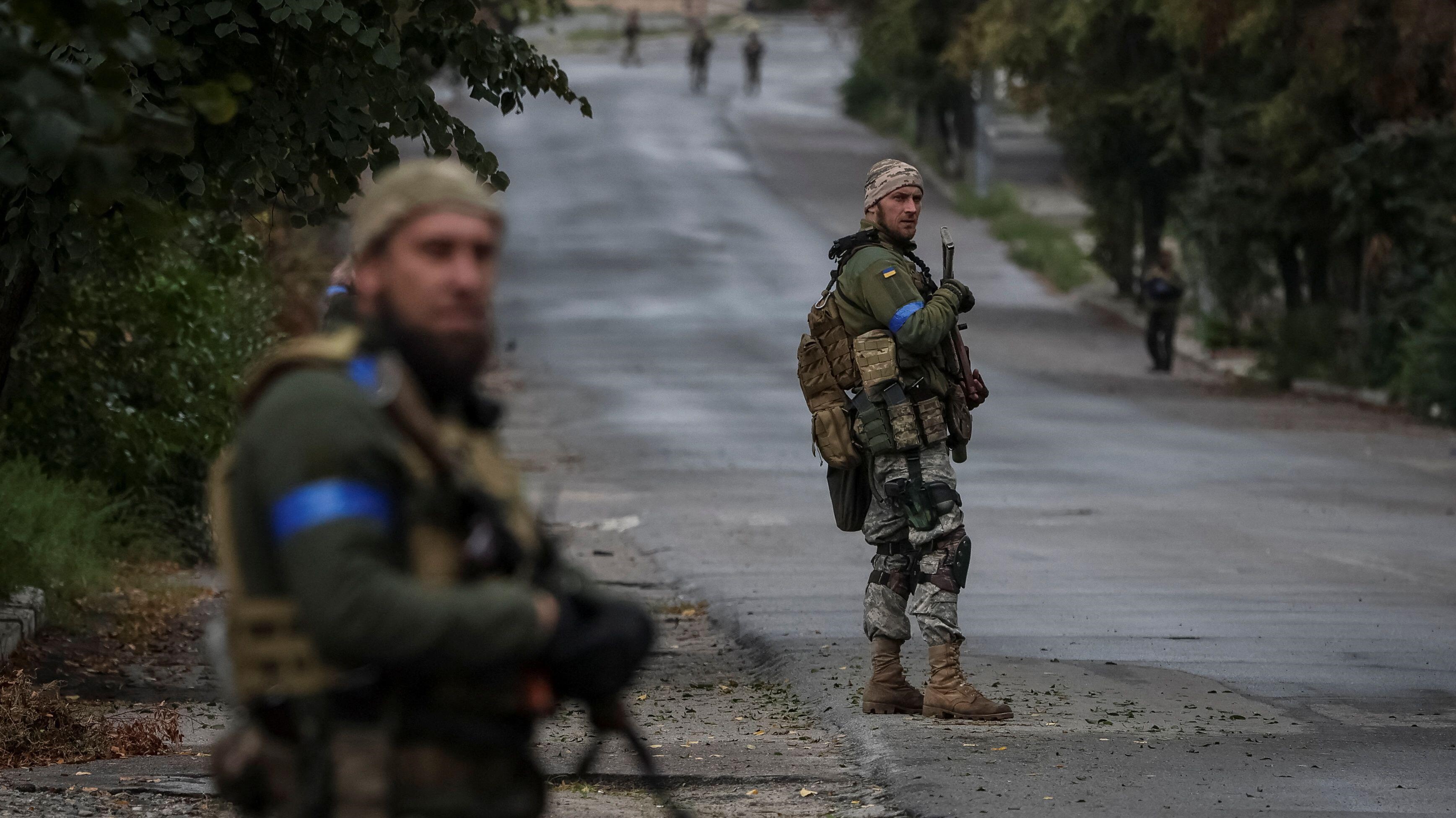 Ukrainian servicemen on patrol, as Russia's attack on Ukraine continues, in the town of Izium, liberated by Ukrainian Armed Forces