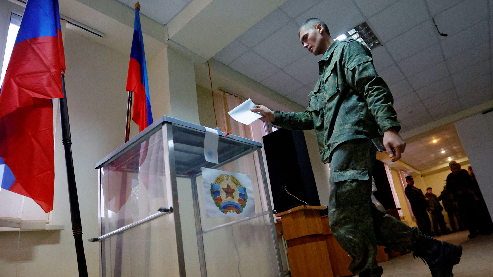 A service member of the self-proclaimed Luhansk People's Republic LPR votes during a referendum on joining LPR to Russia (Picture: REUTERS/Alexander Ermochenko).