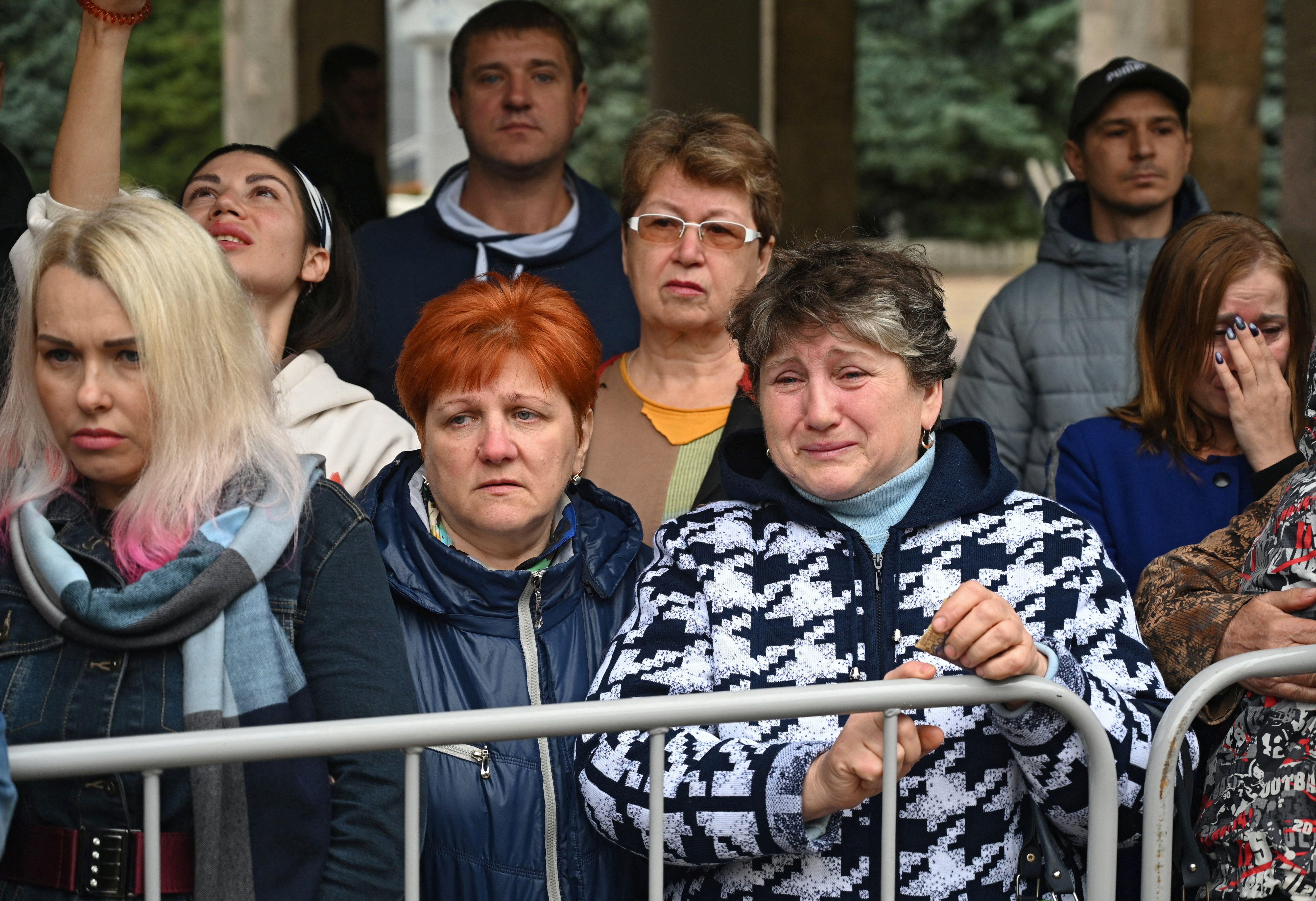 Image ID 2K3DXDG Women react as reservists drafted during partial mobilisation depart for military bases, in the city of Bataysk, in the Rostov region, Russia September 26, 2022. CREDIT REUTERS Sergey Pivovarov 