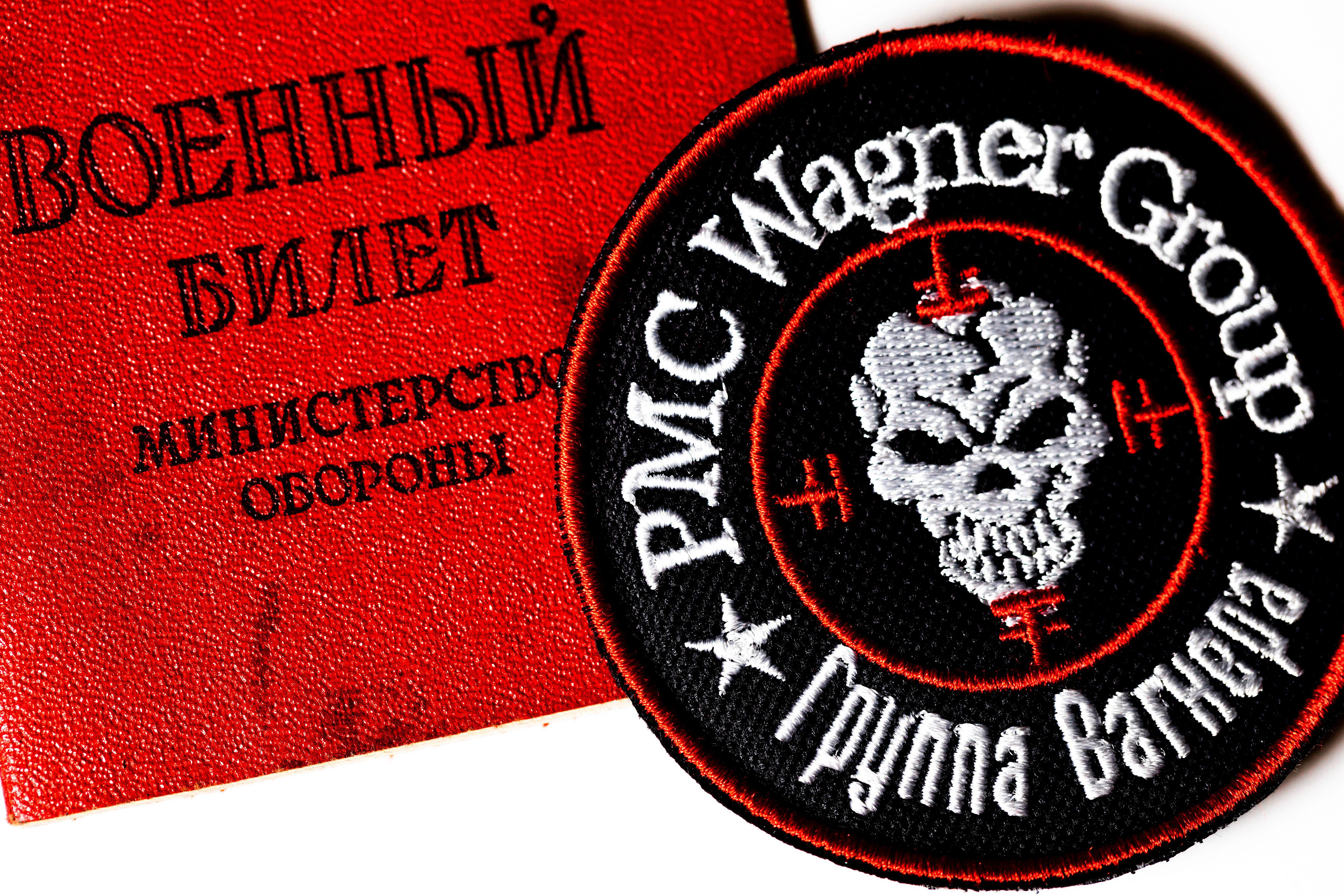 Logo of the Russian private military company Wagner Group and Russian military ID on white background (Picture: Alamy).