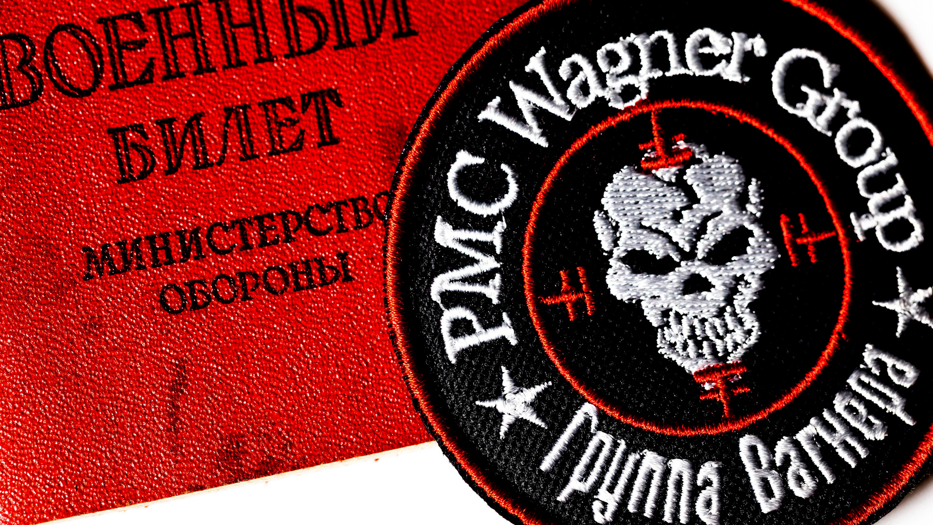 Image ID 2K5N9MA View of a logo of the Russian private military company Wagner Group and Russian military ID on white background