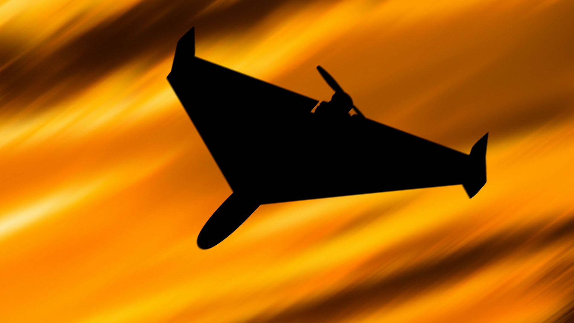 Silhouette of an Iranian kamikaze drone Shahed136 at sunset. Combat drone used by Russia in the bombing of Ukraine in the war