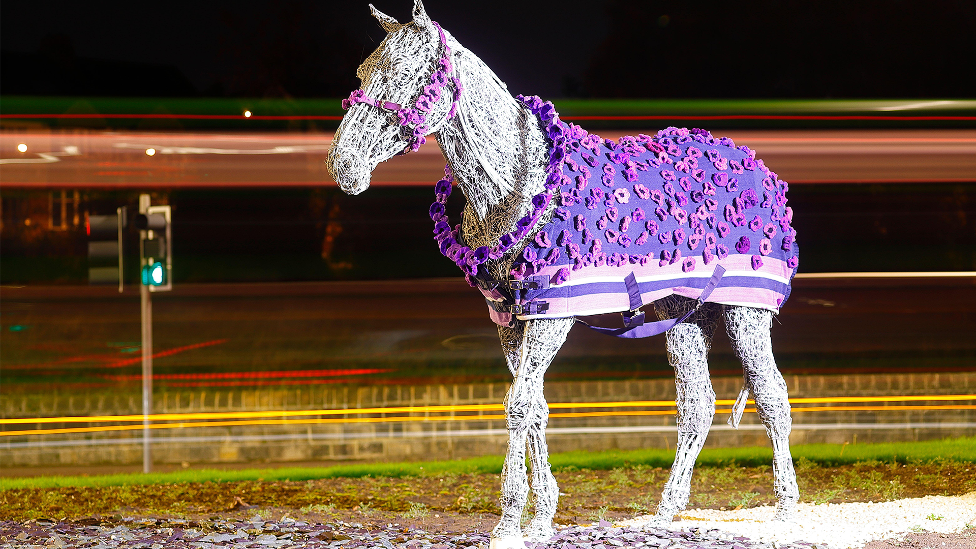 Image ID 2KE1P7K The Horse sculpture at Horsforth in Leeds has been given a new Purple Poppy Coat by Murphy's Army Purple Poppy Campaign CREDIT ALAMY