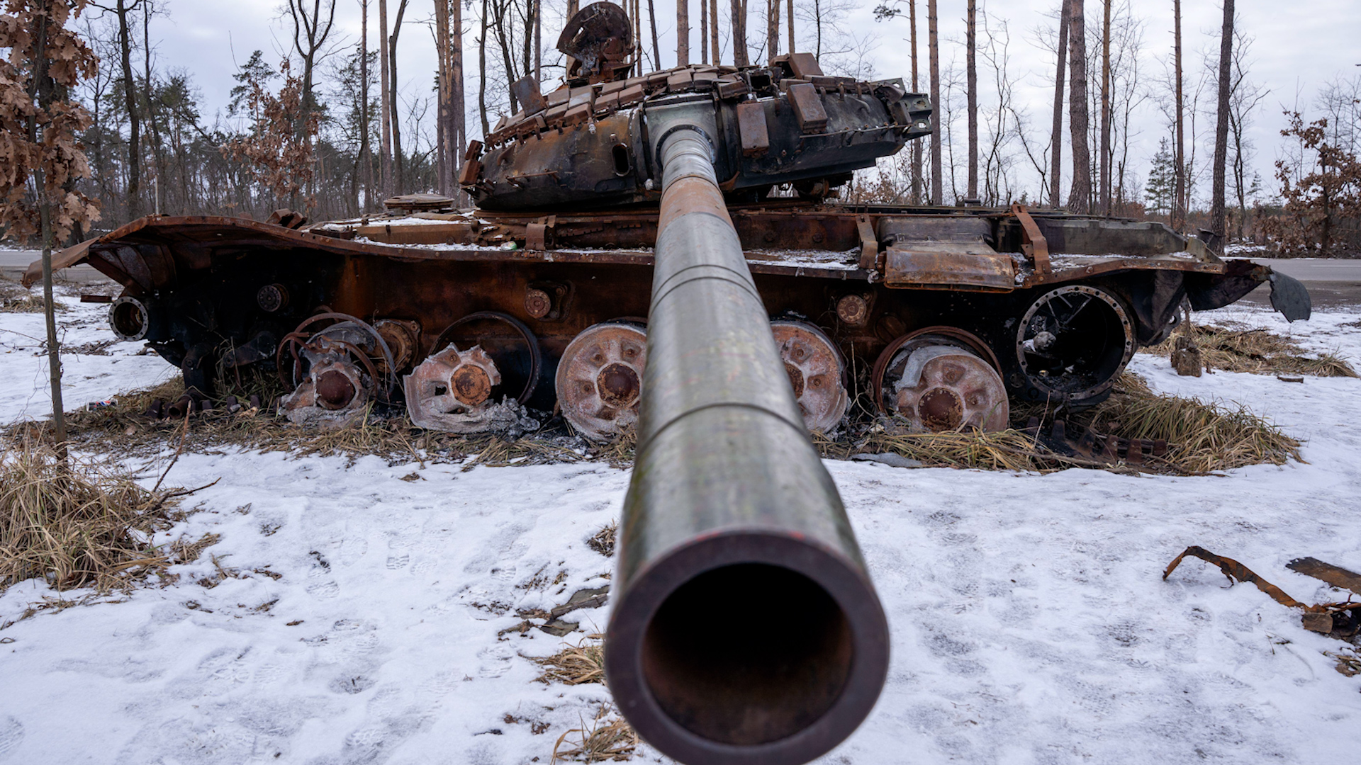 Destroyed Russian Tank lays beside the road in Bucha