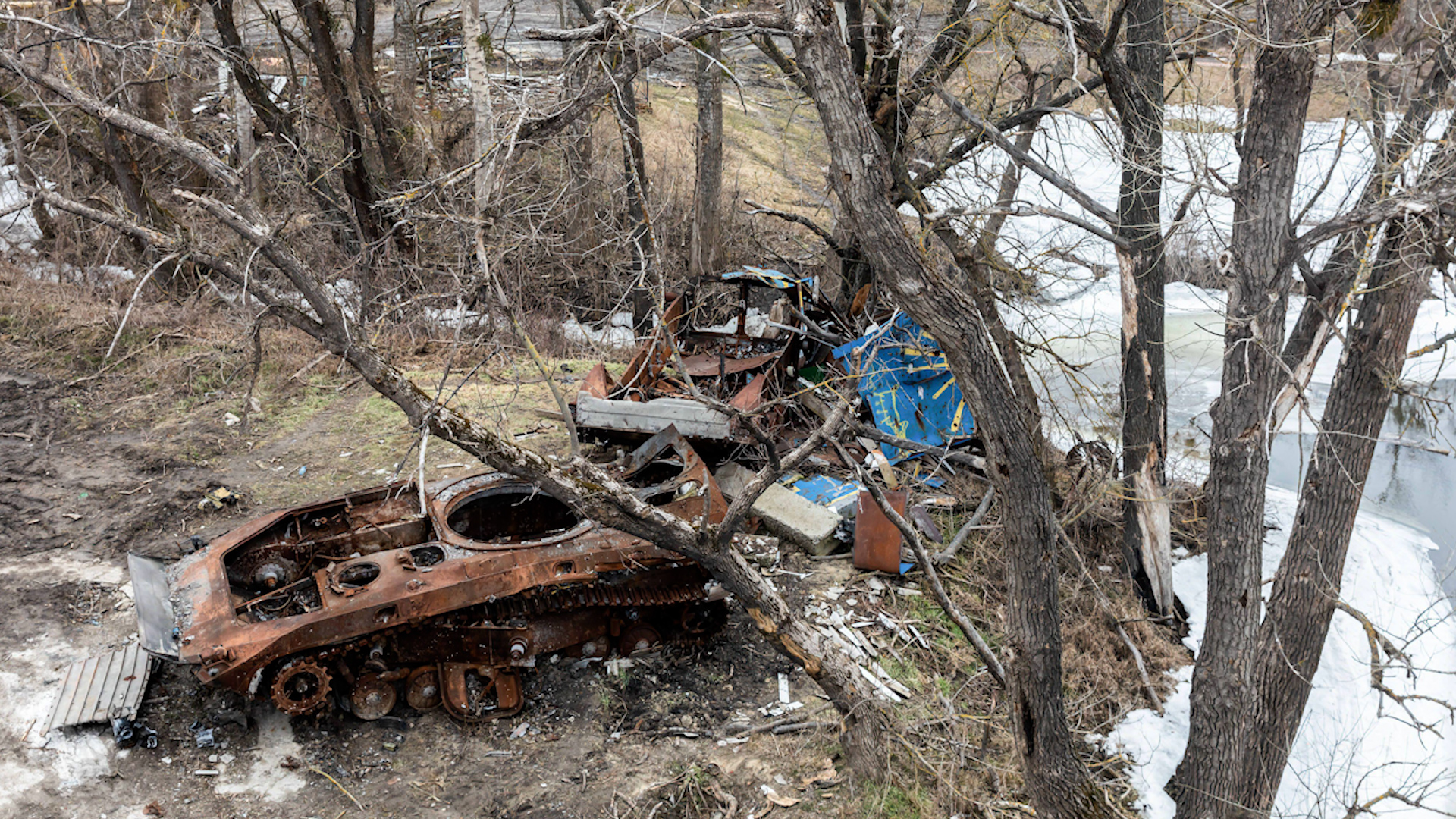 Image ID 2P26GBH burnt tank and destroyed trees in Bogorodychne, Ukraine, Donetsk Oblast village 03032023 CREDIT Zuma Alamy EXP 28032024.jpg