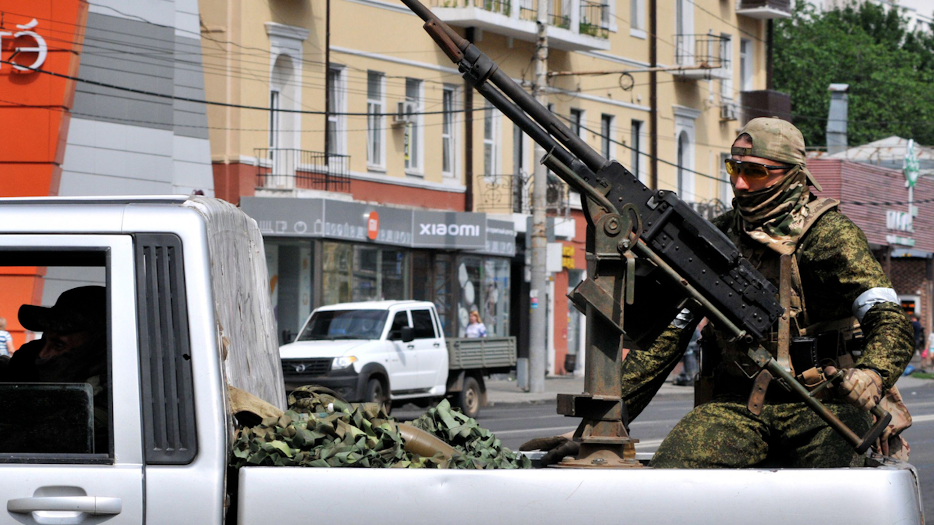 Fighters of the Wagner group pictured outside the Russian Southern Military District staff HQ (Picture: Alamy).