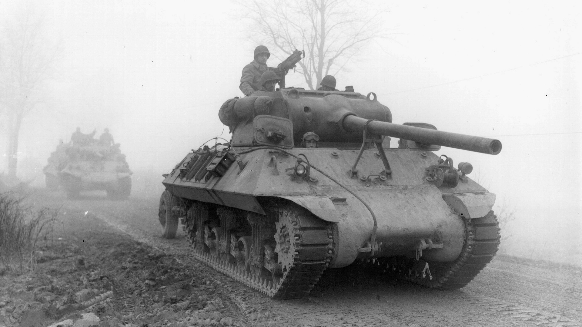 Image ID 2RHHTNE US Army tanks advances through Belgium, during a major German counter-attack NO REUSE CREDIT ALAMY