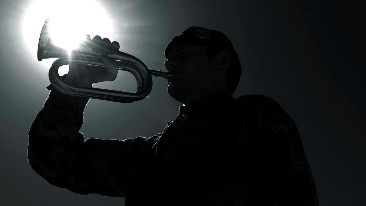 Image ID 45150476 A bugler plays the Last Post at a Remembrance Service in Lashkar Gah, Helmand, Afghanistan in November 2007 CREDIT Crown Copyright