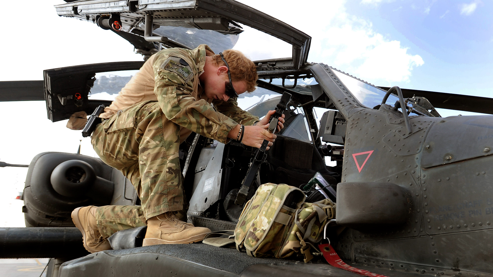 Prince Harry working on an Apache helicopter at Camp Bastion in Afghanistan, 2012 (Picture: WENN Rights Ltd/Alamy Stock Photo).