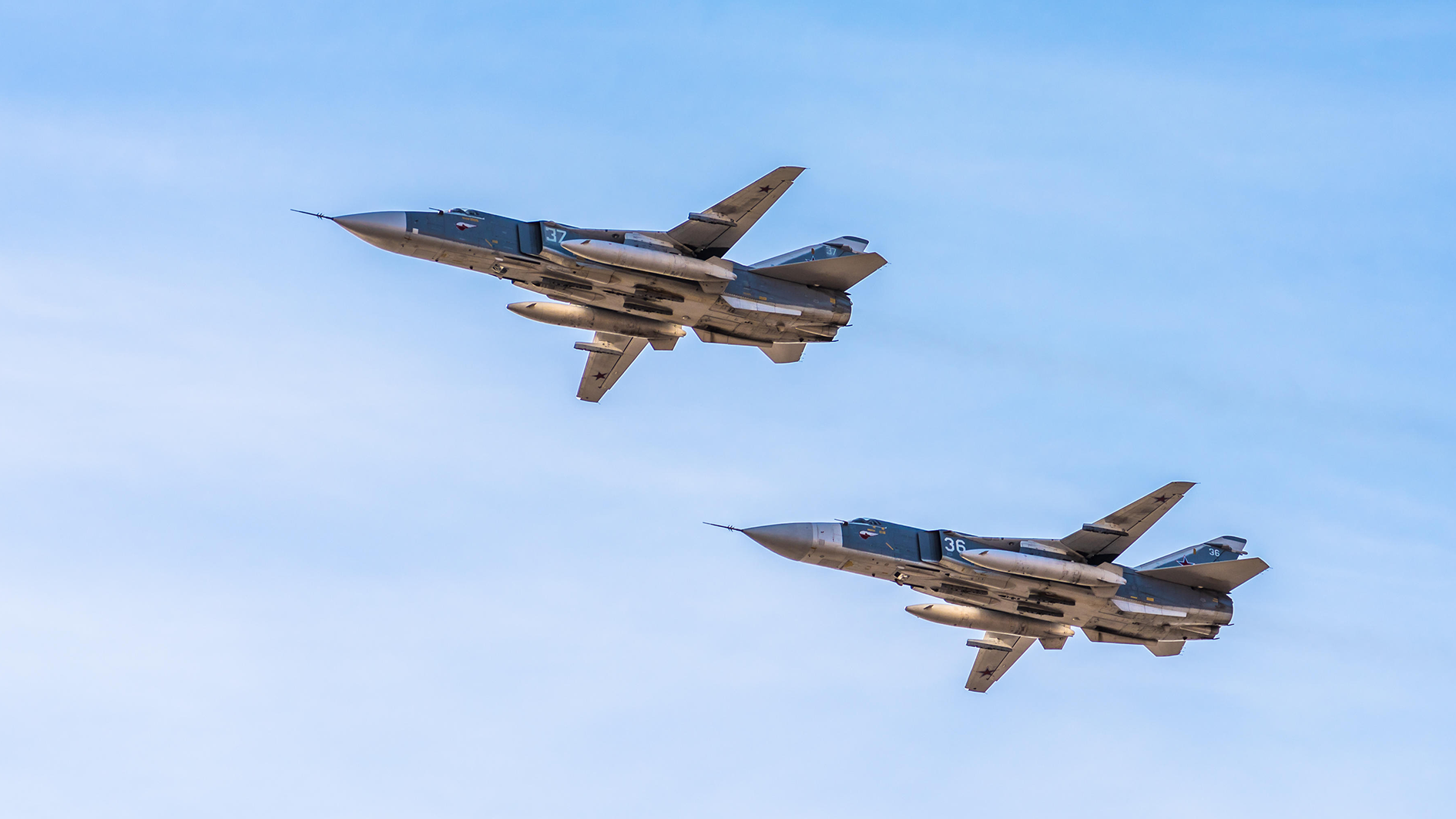 Russian supersonic front-line bombers Sukhoi Su-24 in the sky (Picture: Alamy)