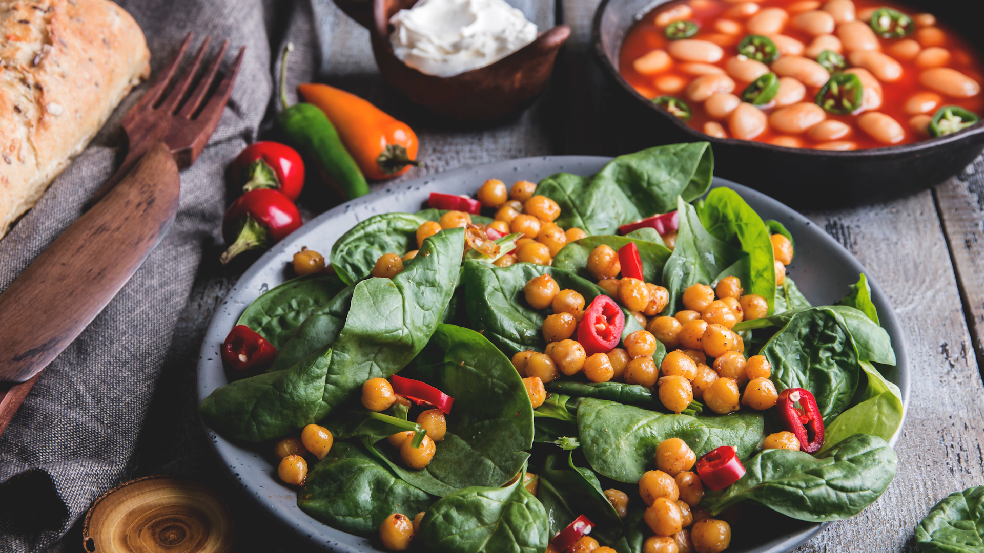 Chickpeas and veggies salad with spinach leaves, healthy homemade vegan food (Picture: kostyantyn manzhura/Alamy Stock Photo).