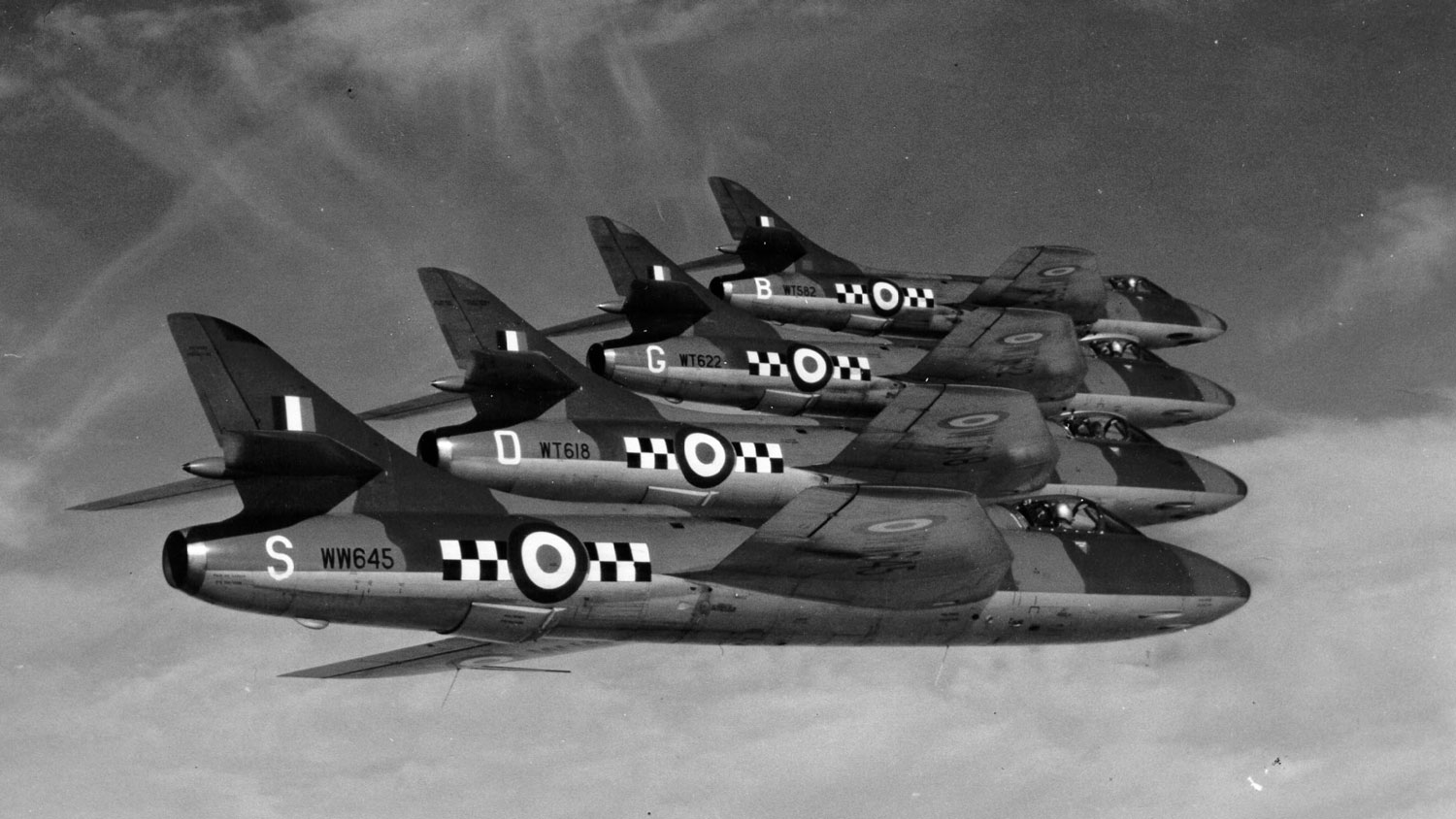 Immaculate formation by the four Hawker Hunters of the No 43 Squadron aerobatic team in October 1955 CREDIT Crown Copyright