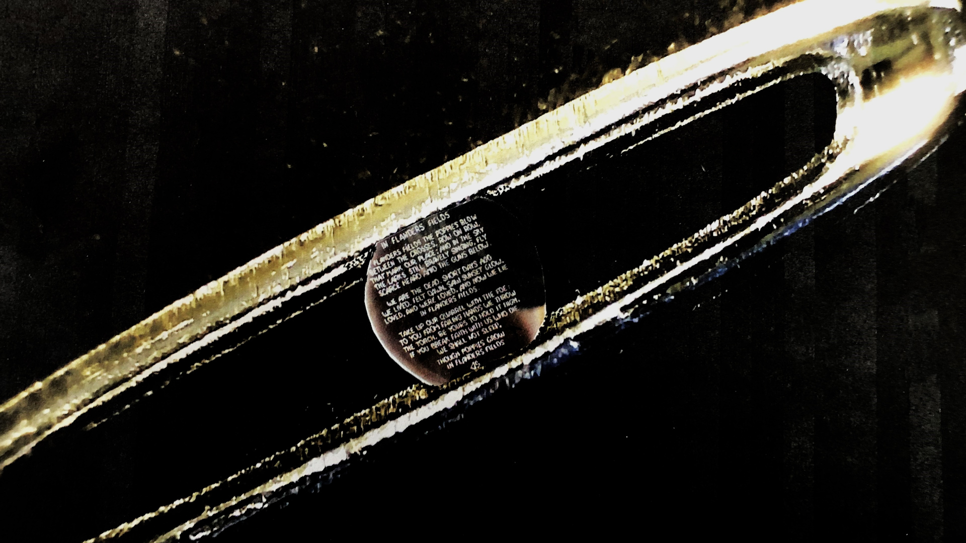 The microscopic poem within the eye of the needle 