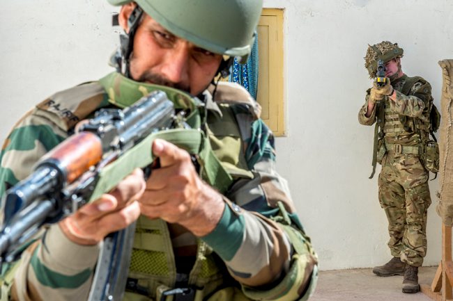 Members of the 1st Batallion The Royal Anglian Regiment, along with their Indian counterparts, being briefed before undertaking a joint exercise in Exercise Ajeya Warrior 2017. Crown copyright.