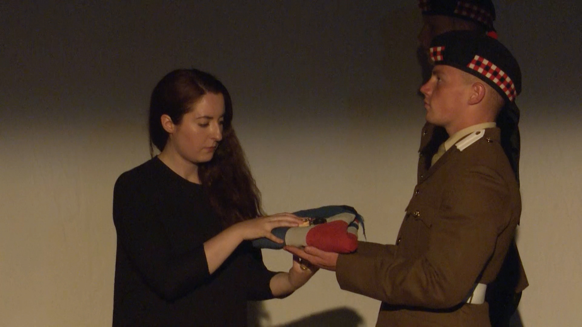 Actress MJ Deans receives a Union Flag. 