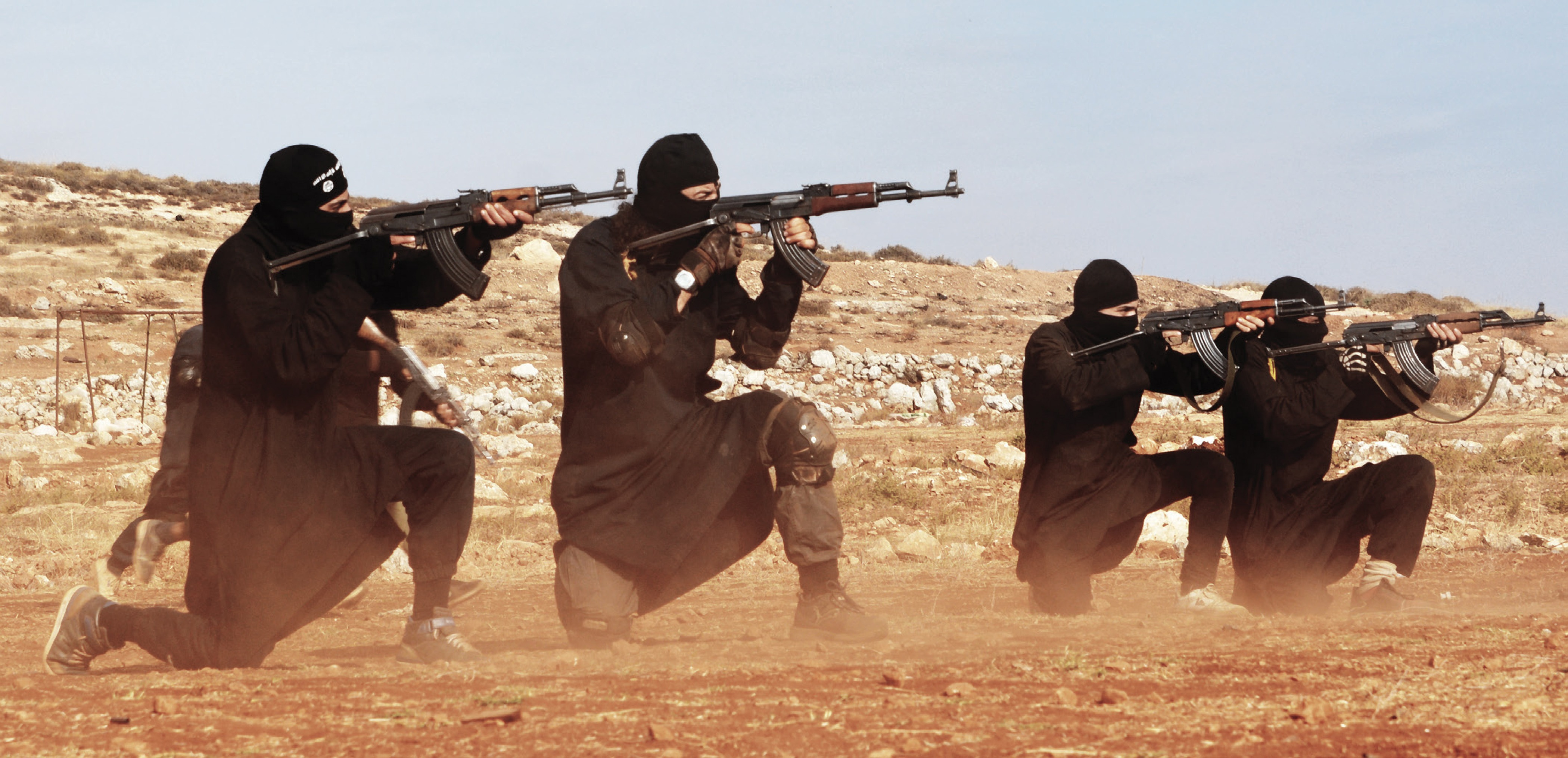Islamic State militants firing AK-47 rifles