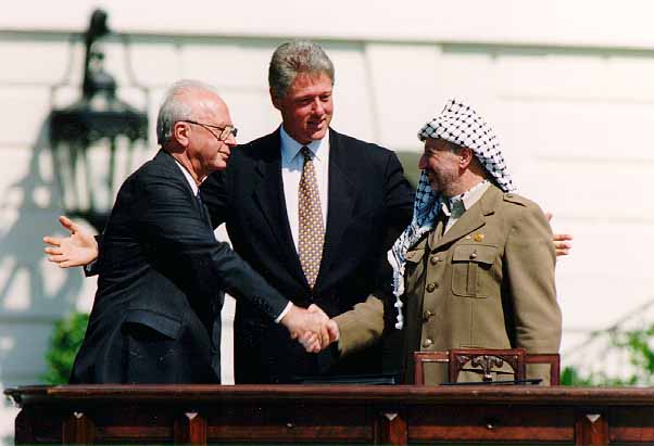 President Bill Clinton with Israeli Prime Minister Yitzhak Rabin (left) and chairman of the PLO (Palestinian Liberation Organization) Yassir Arafat in 1993
