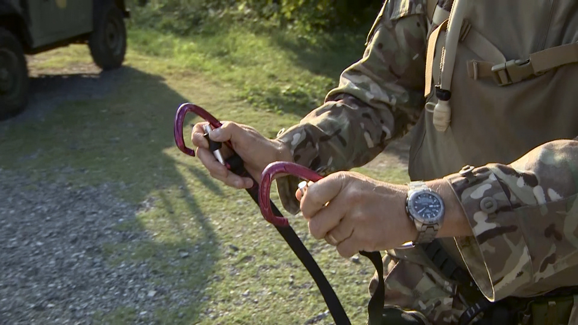 Chaplain Paul Whitehead shows off his carabiner clips.