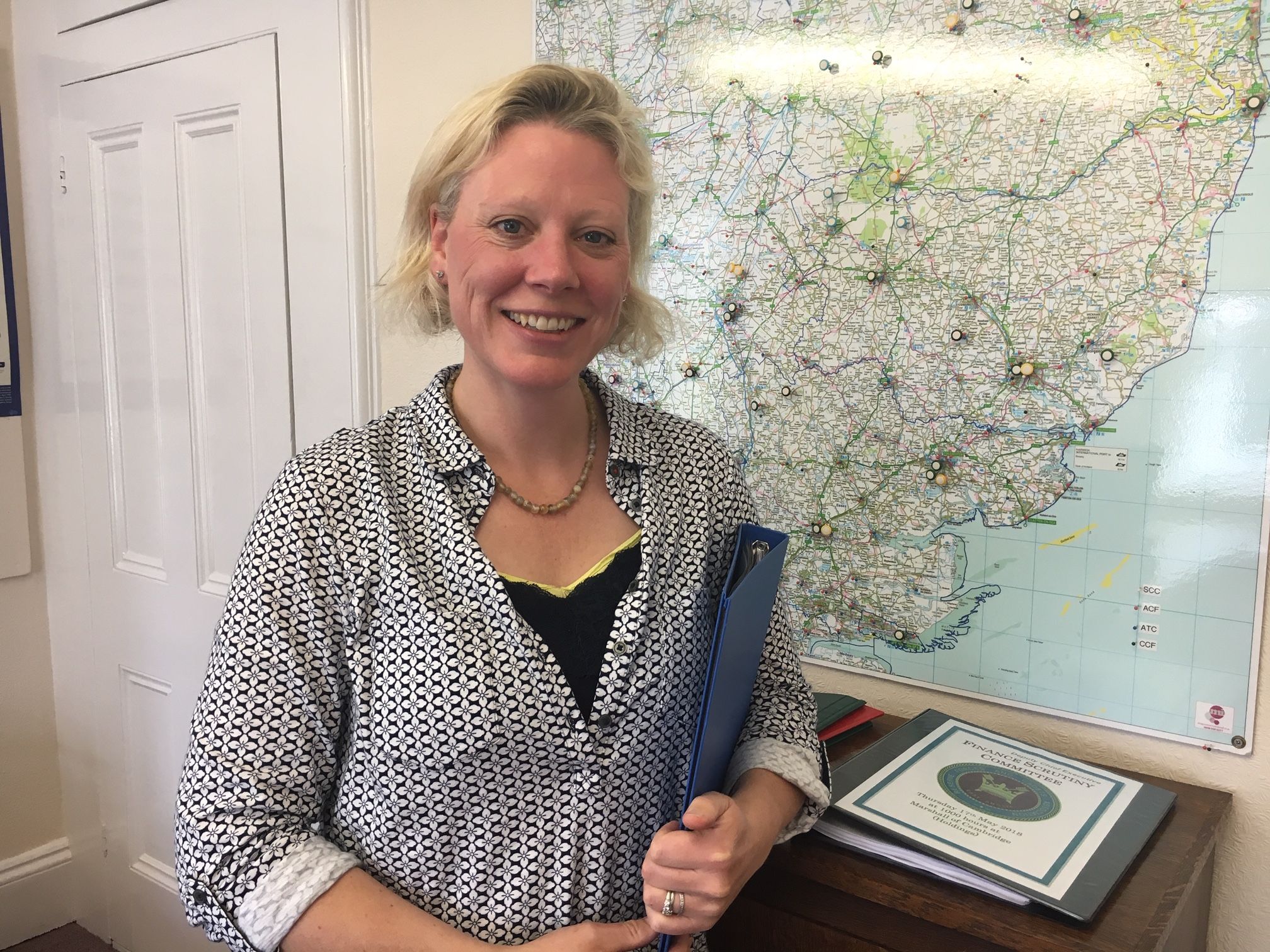 Smiling Jane Wilkes in her office