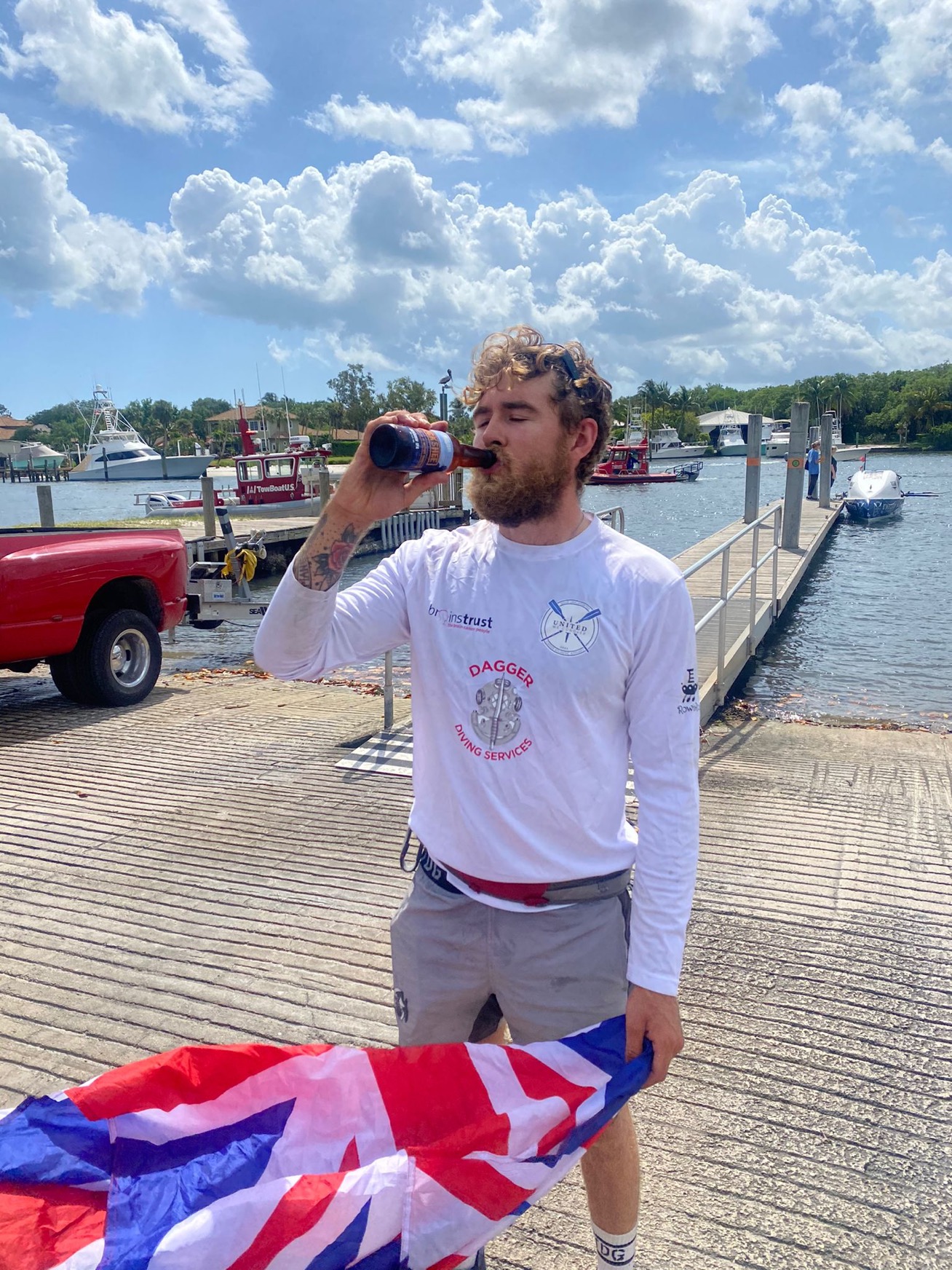 Jack Jarvis having a well-earned beer after rowing the Atlantic Ocean