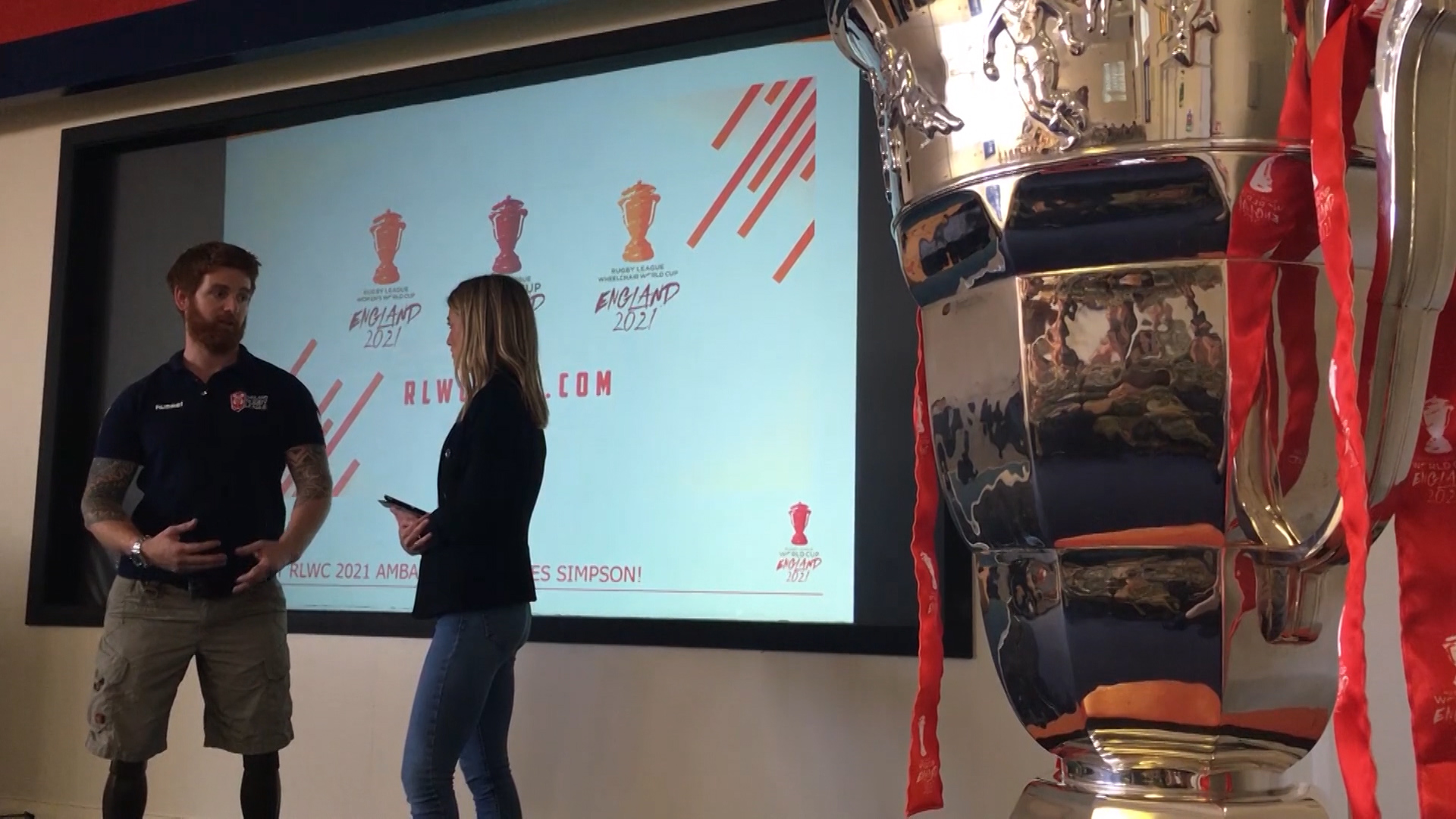James Simpson alongside Wheelchair Rugby League World Cup trophy.