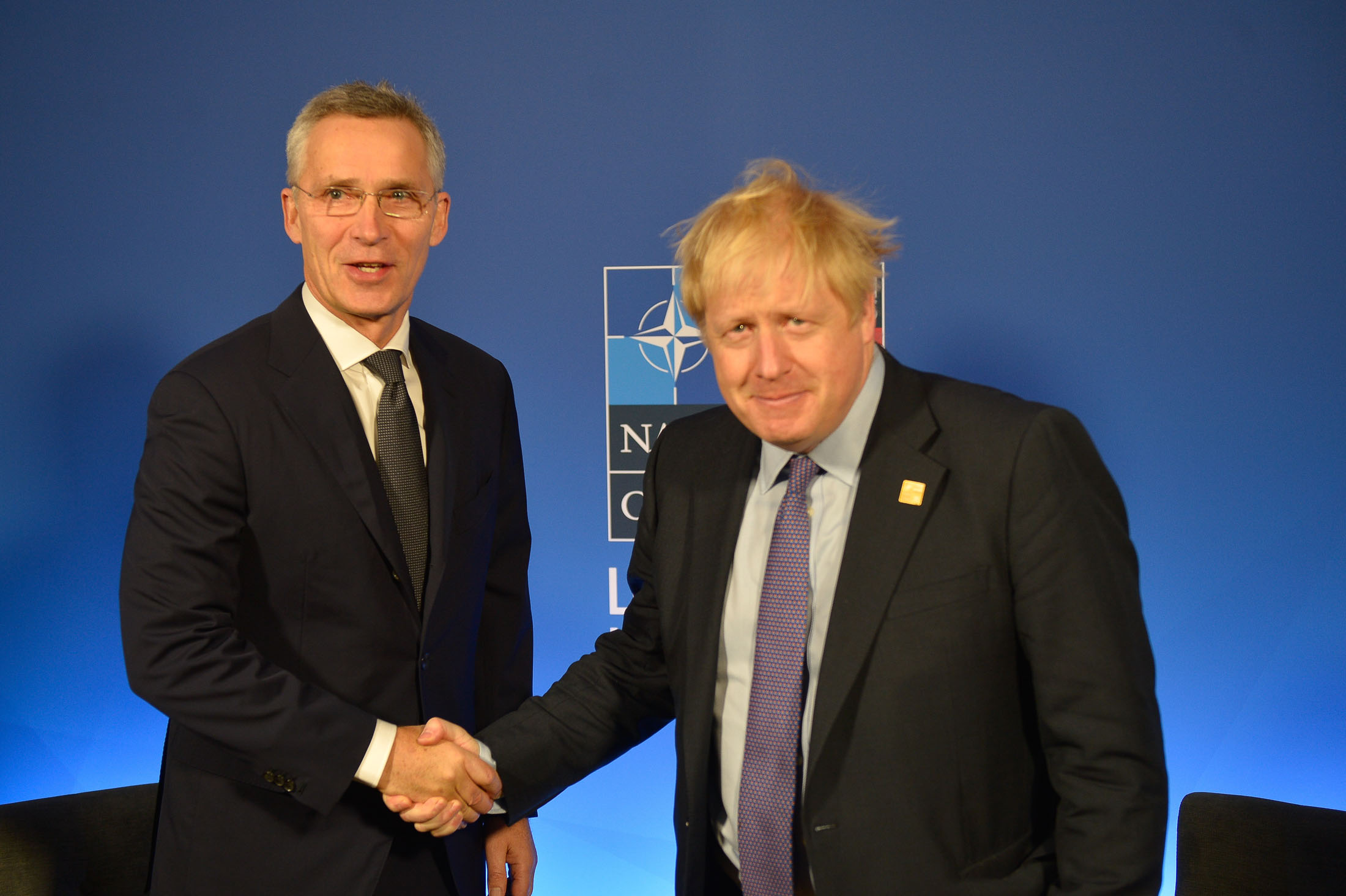 Jens Stoltenberg and Boris Johnson handshake