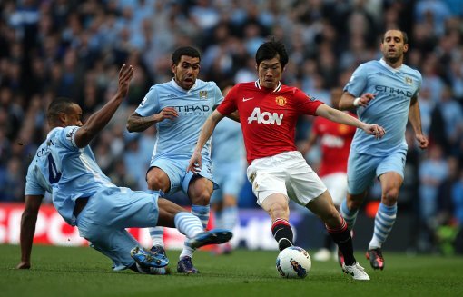 Ji-Sung Park against Manchester City in 2012 (Picture: PA).