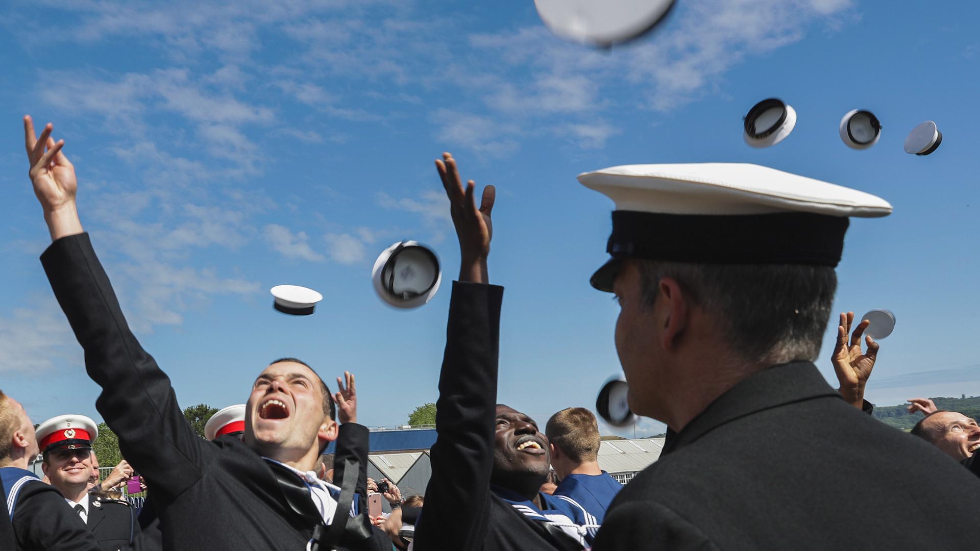 Cover image: A library image of junior ratings celebrating passing out at HMS Raleigh (Picture: Royal Navy).