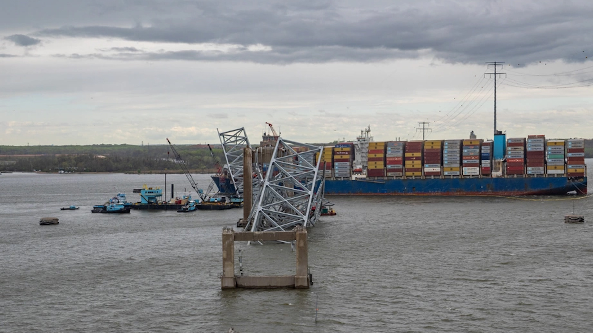 Key Bridge Response 2024 Unified Command salvors use the crane barge Chesapeake 1000 to move a large piece of supporting steel from the collapsed Francis Scott Key Bridge