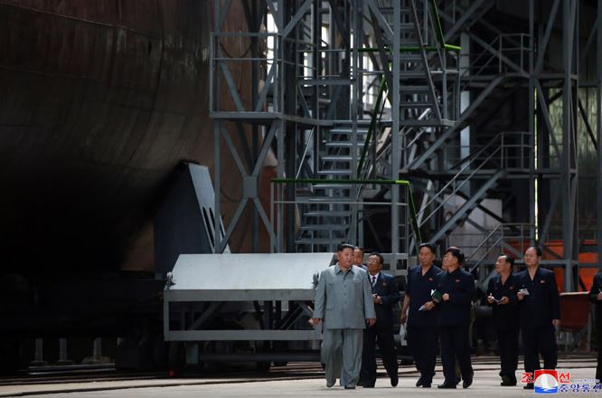 Kim Jong Un visits submarine building site (Picture: KCNA).