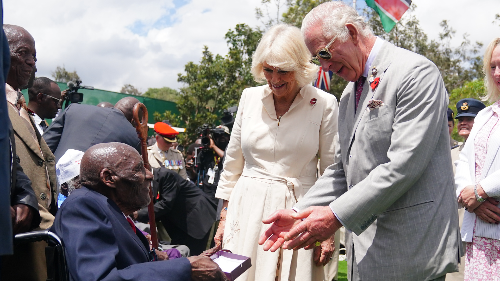 King Charles III and Queen Camilla meet veteran Samwel Nthigai Mburia, who is believed to be 117 years old, to present him with WWII medals