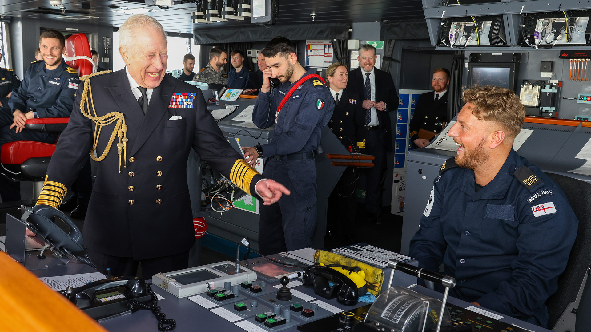 King Charles jokes with Royal Navy crew on the bridge of the HMS Prince of Wales