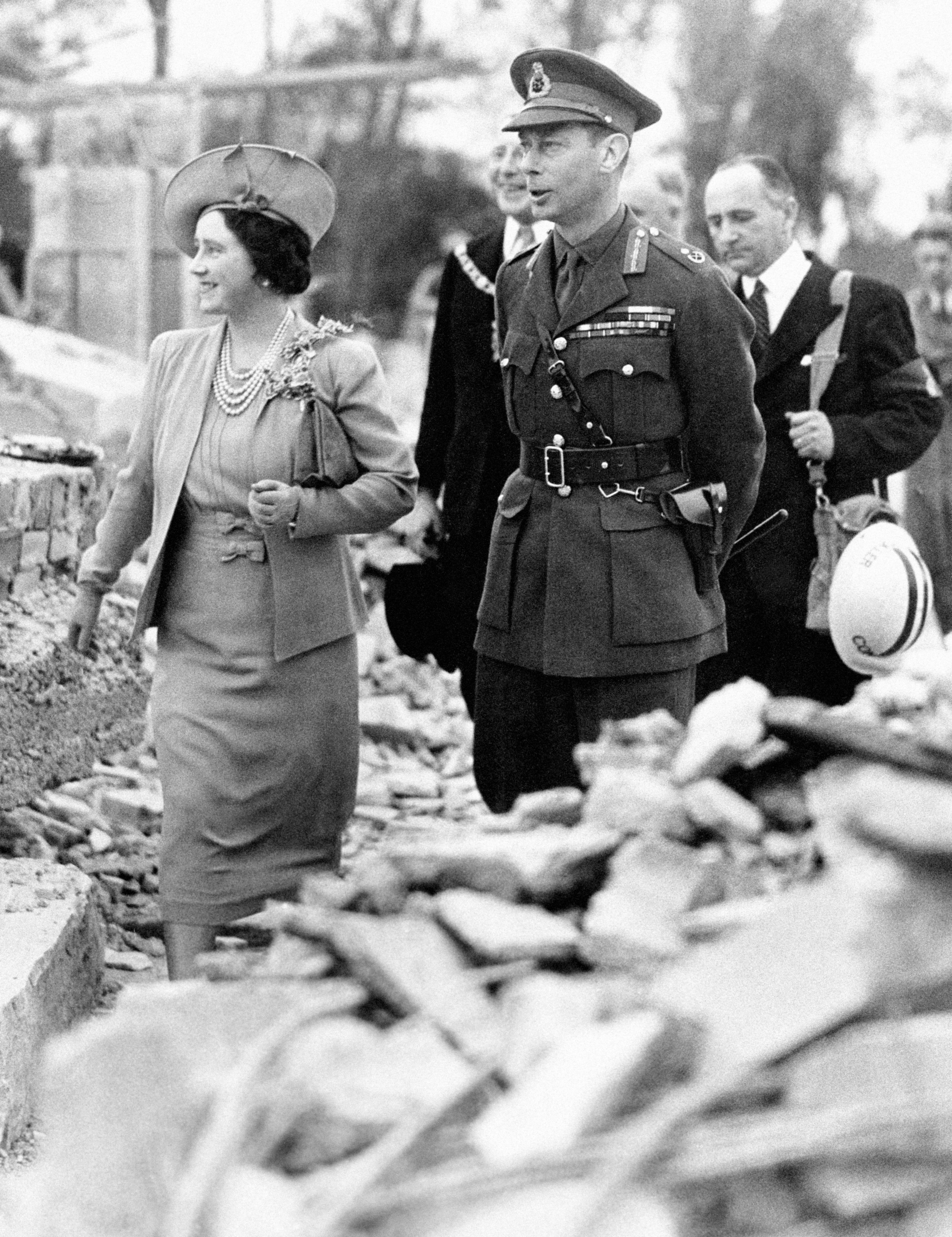 King George VI and Queen Elizabeth inspect a bombed district of north-west London during the Blitz in September 1940 (Picture: PA).